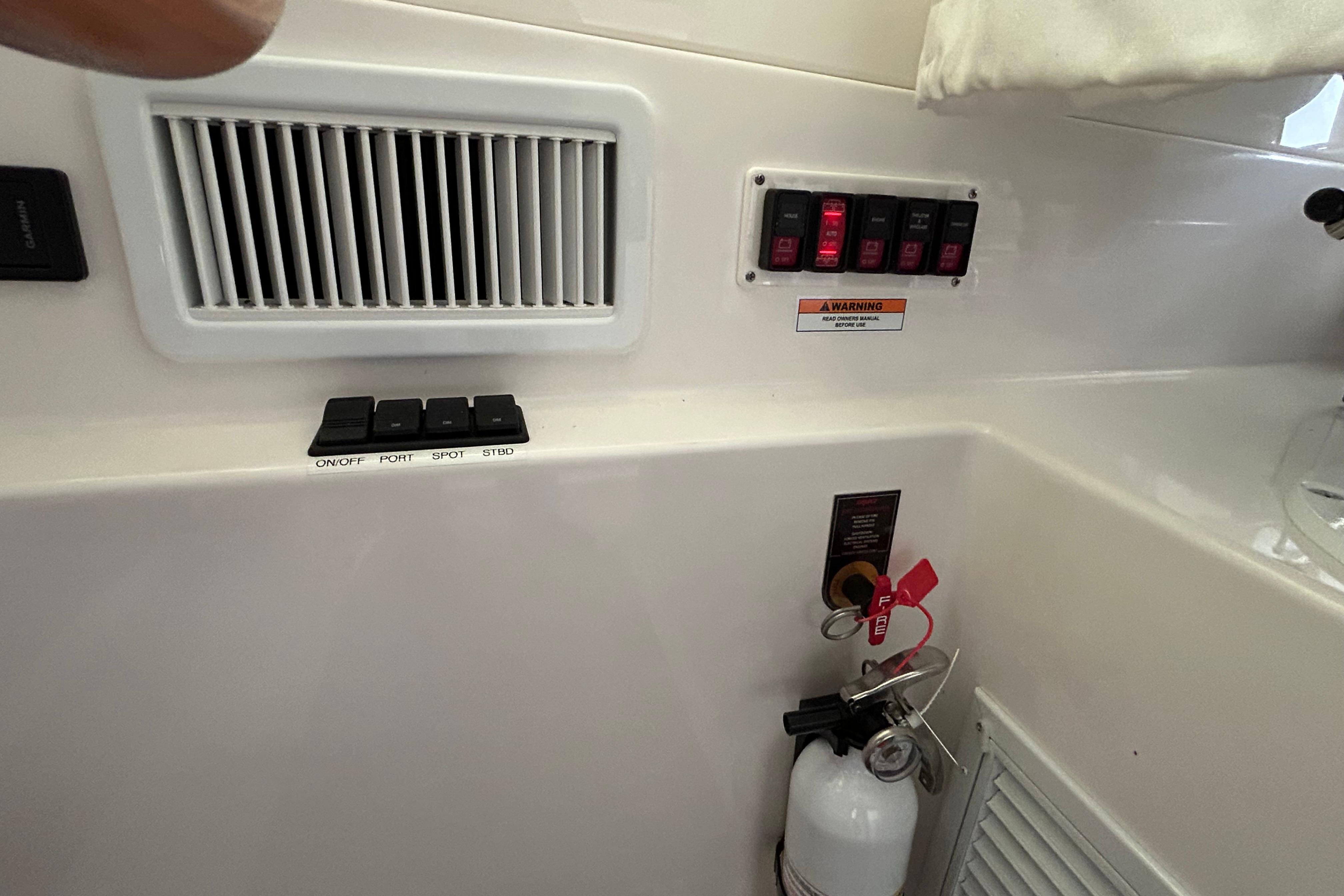 Hel deck air conditioning, battery switches and fire extinguisher.