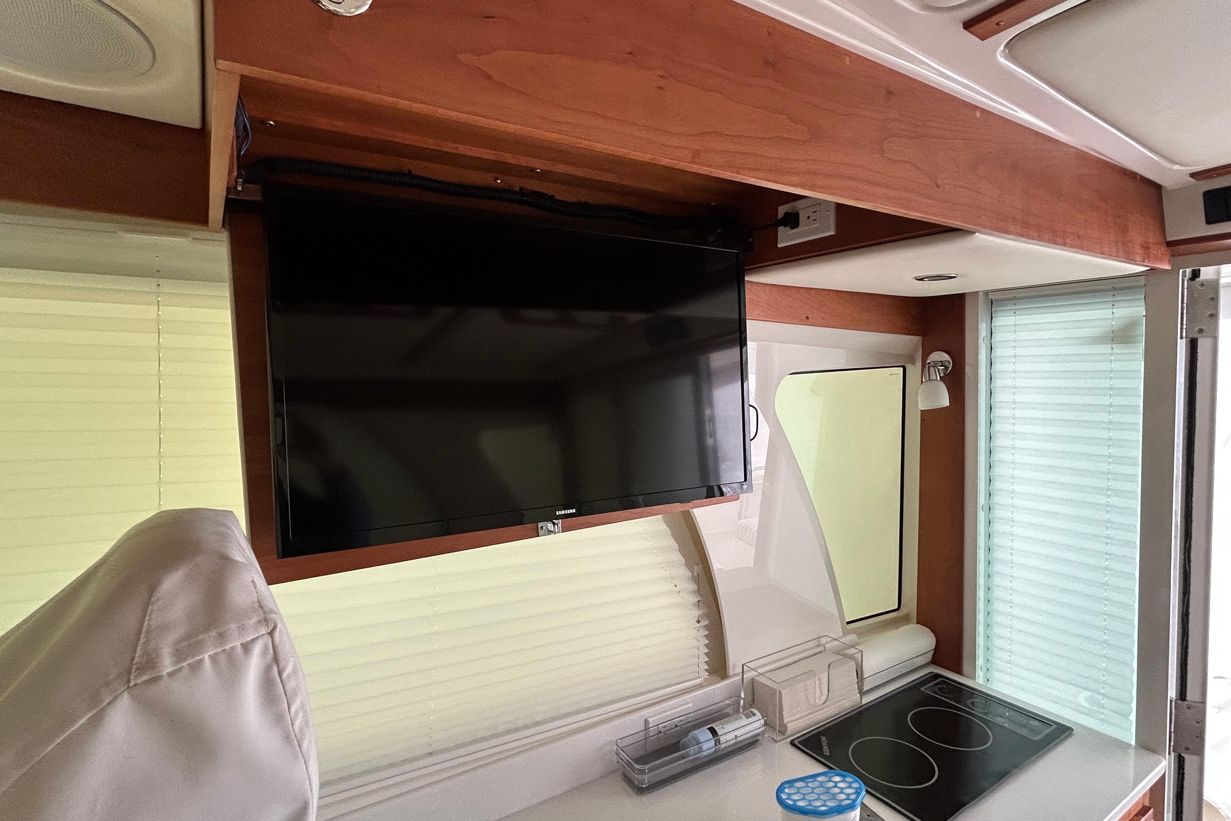 Fold out TV above galley