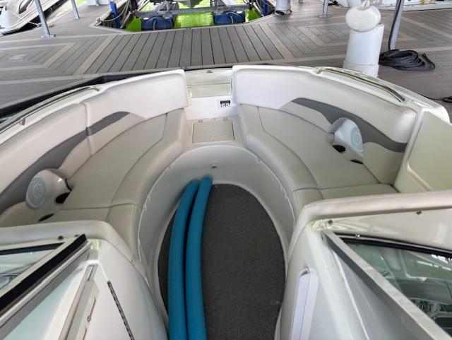 2007 Chaparral Sunesta 274 boat interior with seating and storage compartments.