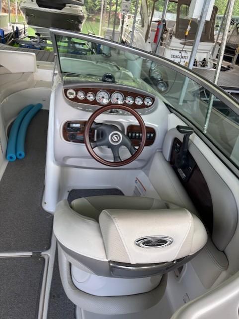 2007 Chaparral Sunesta 274 boat interior with steering wheel and dashboard.