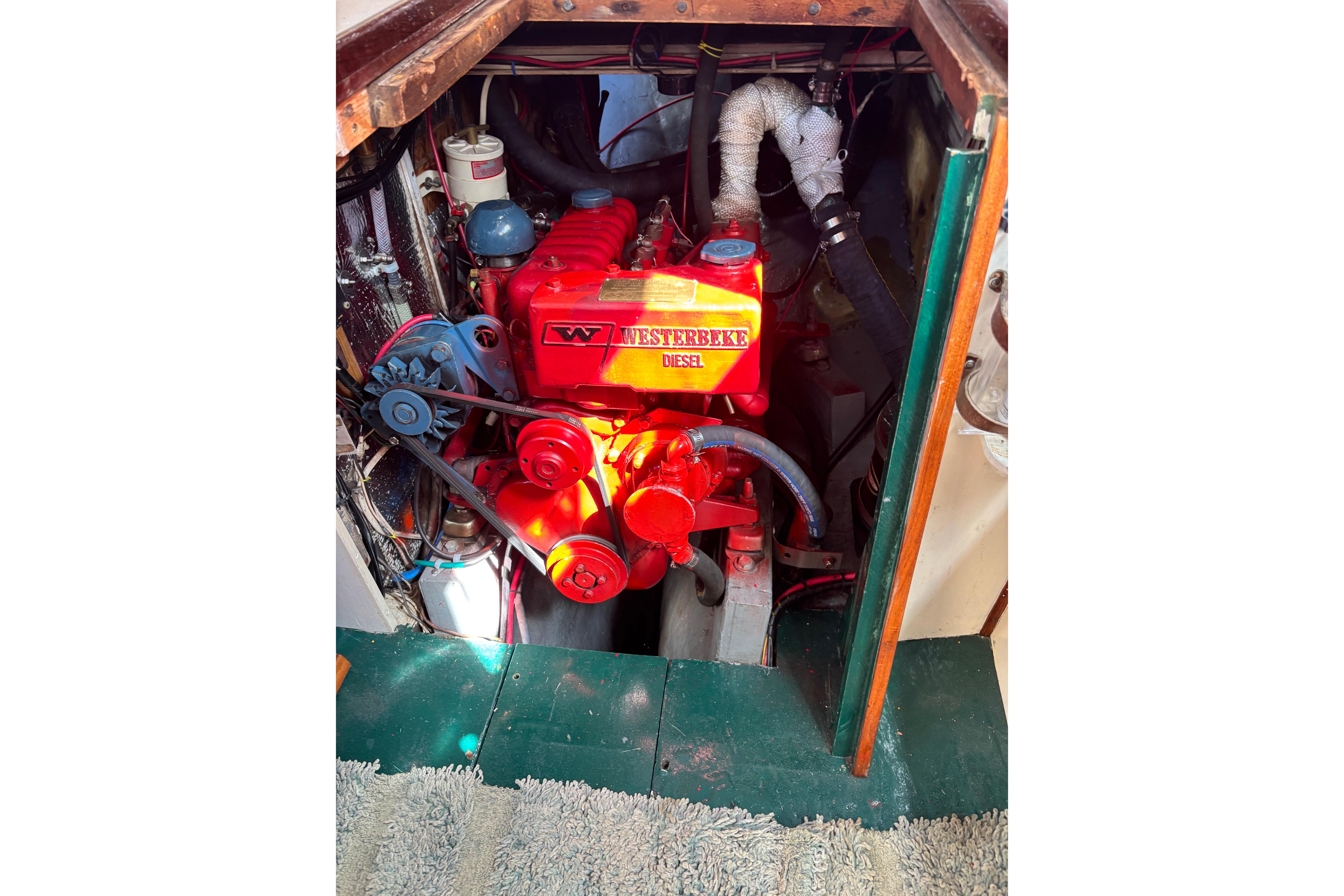1968 Spencer 35 engine compartment with red Westerbeke diesel engine.