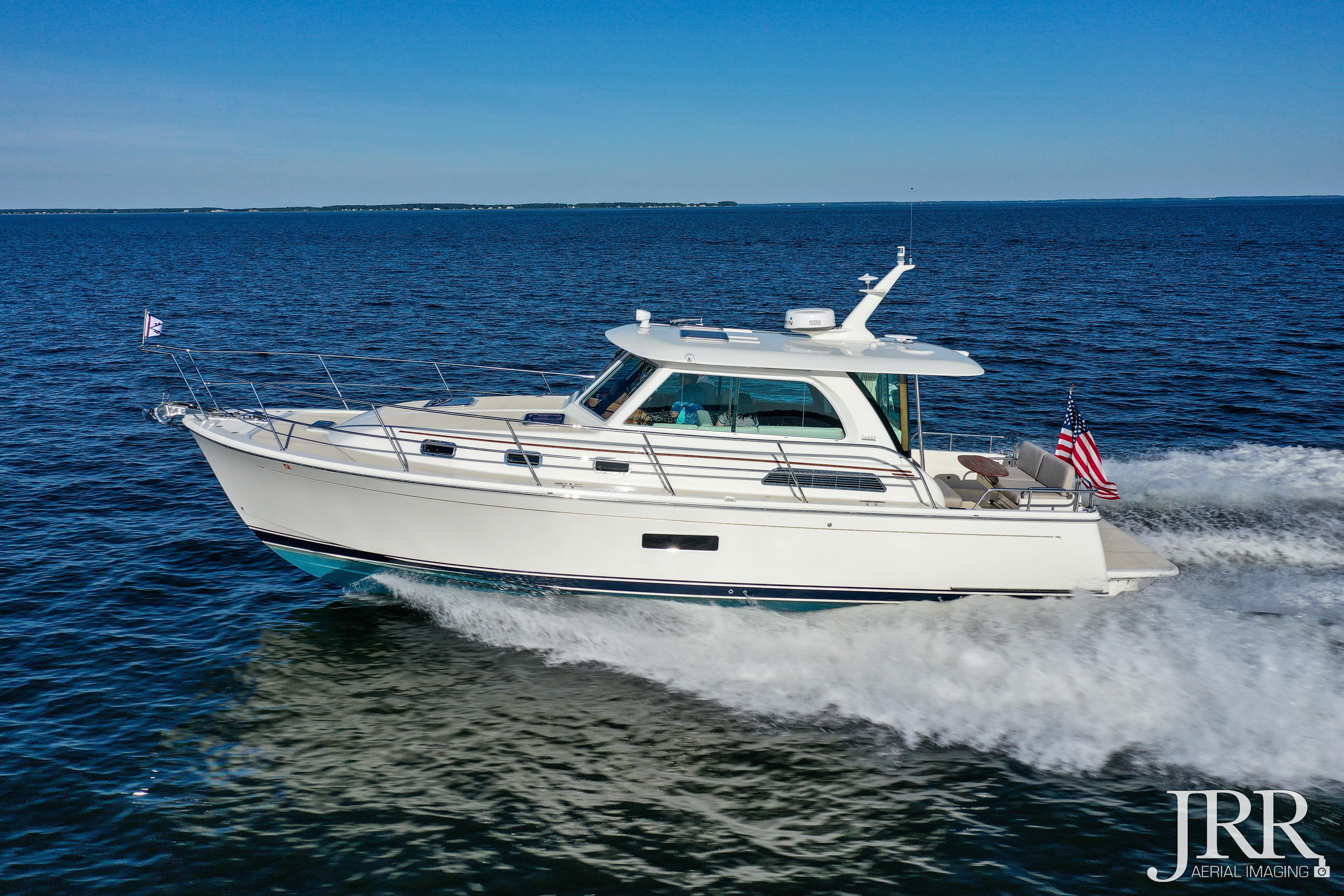 2019 Sabre 38 Salon Express cruising on open water under clear blue skies.