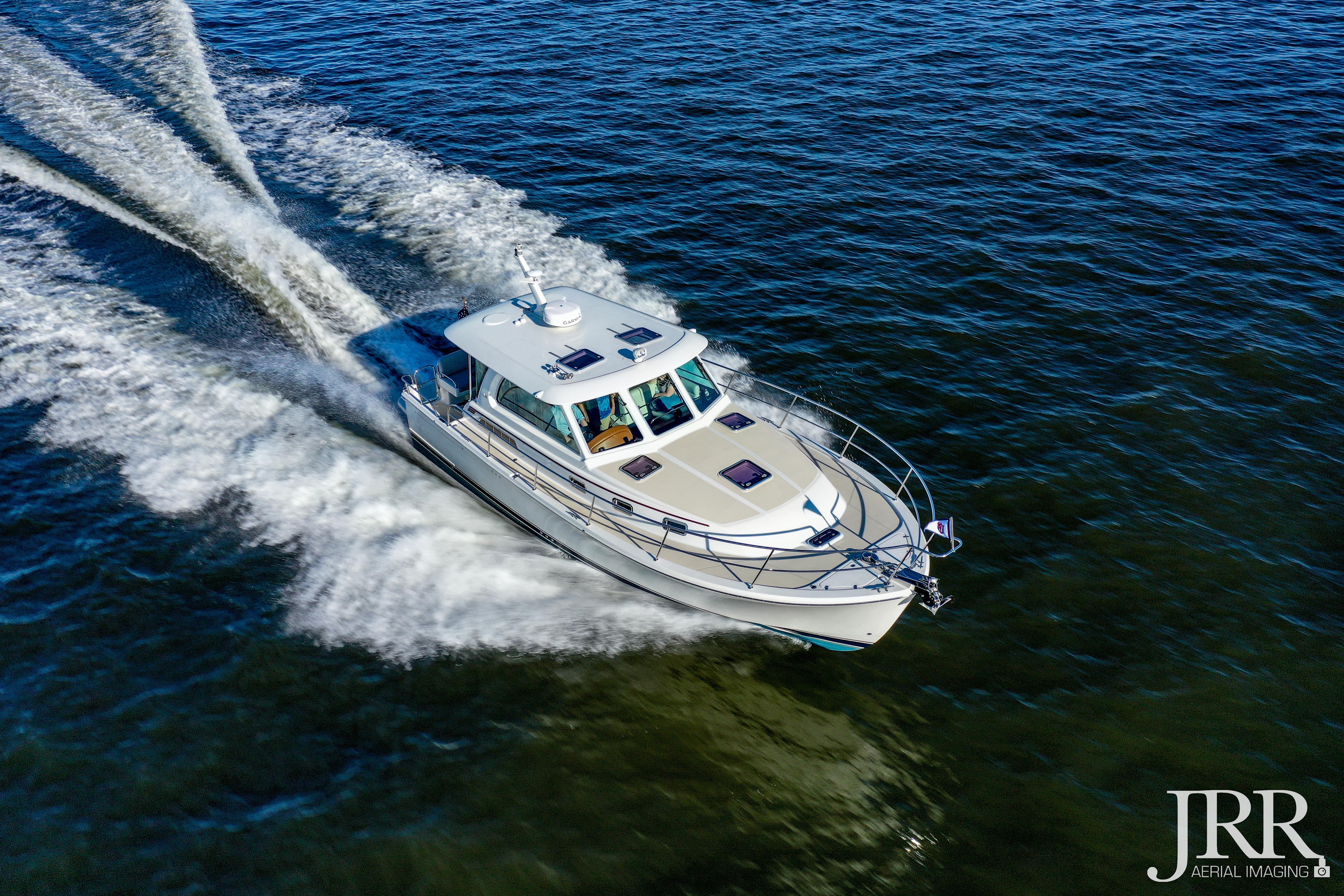2019 Sabre 38 Salon Express cruising on open water, aerial view.