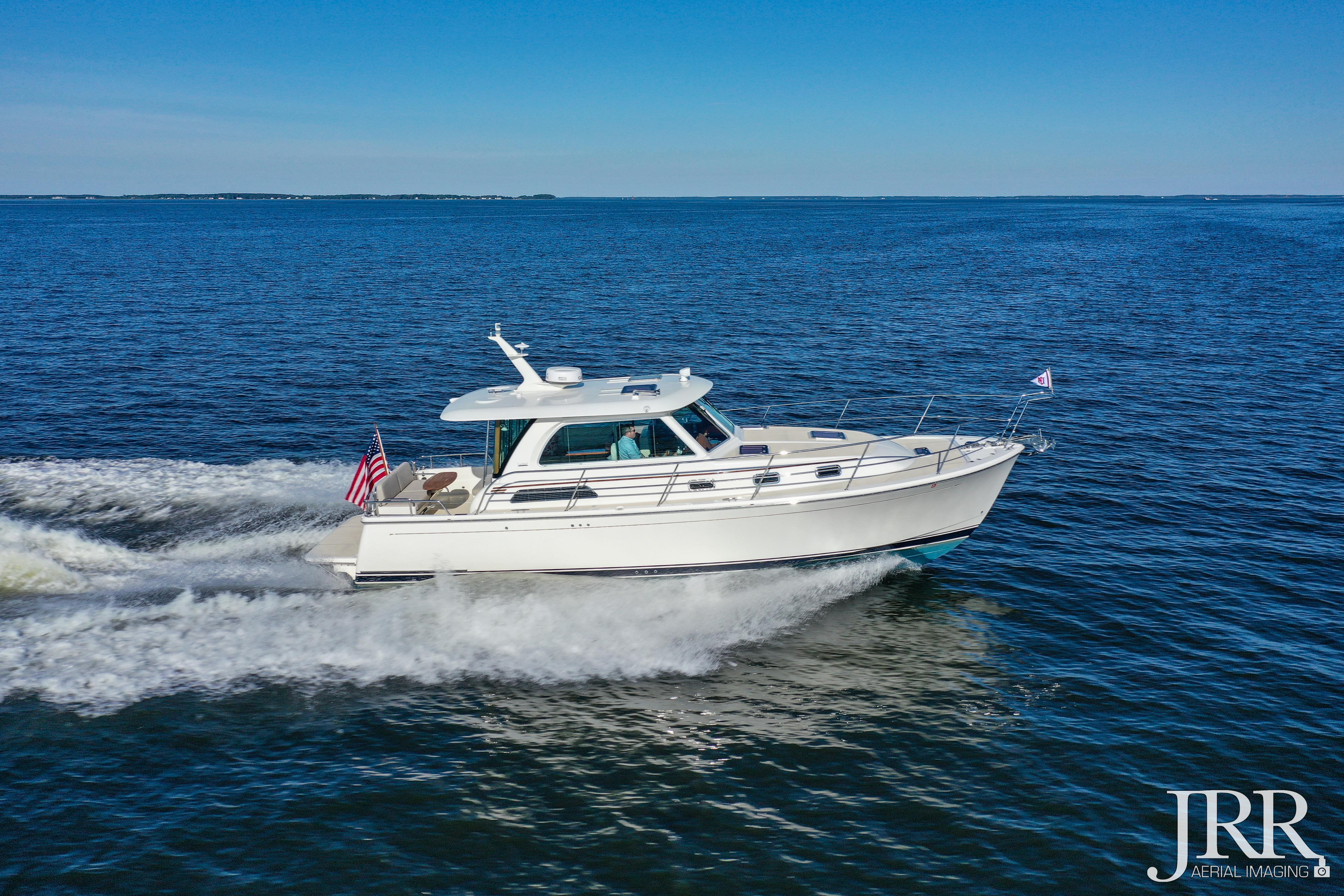 2019 Sabre 38 Salon Express cruising on open water under clear blue skies.
