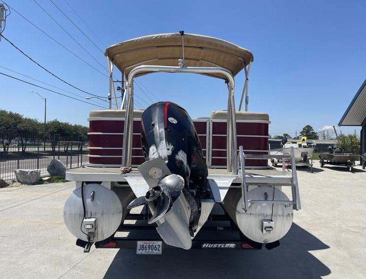 2018 Veranda 22 pontoon boat with outboard motor, parked on a trailer.
