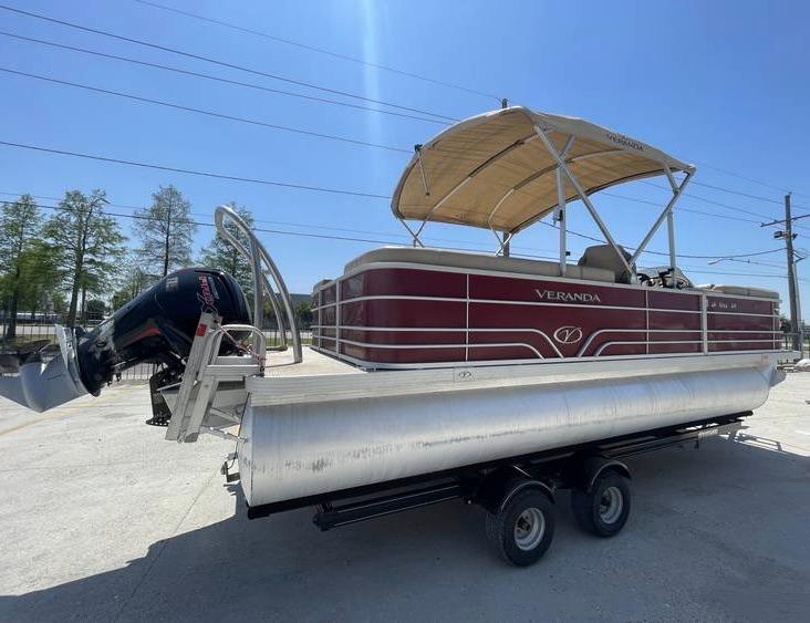 2018 Veranda 22 pontoon boat on trailer, featuring a canopy and outboard motor.