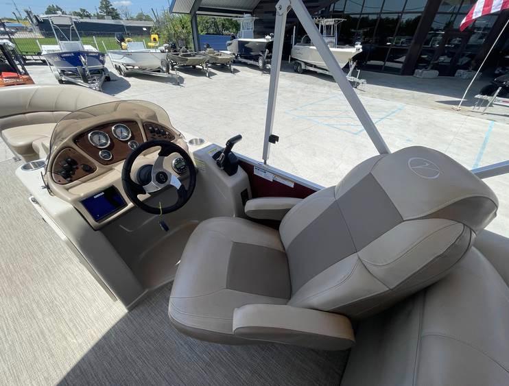 Captain's seat and helm of 2018 Veranda 22 boat, featuring modern controls and comfortable seating.