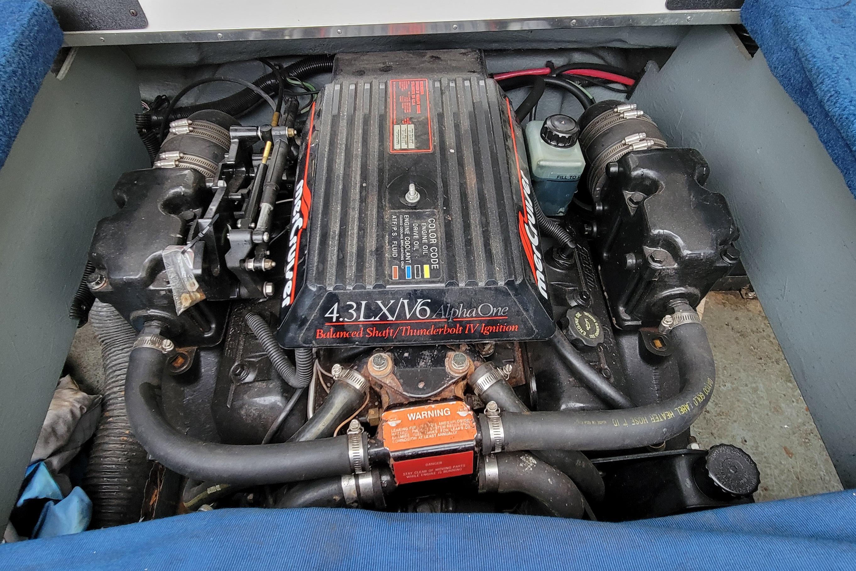 Engine of a 1994 Sea Ray 180 Bow Rider boat, featuring 4.3LX V6 Alpha One.