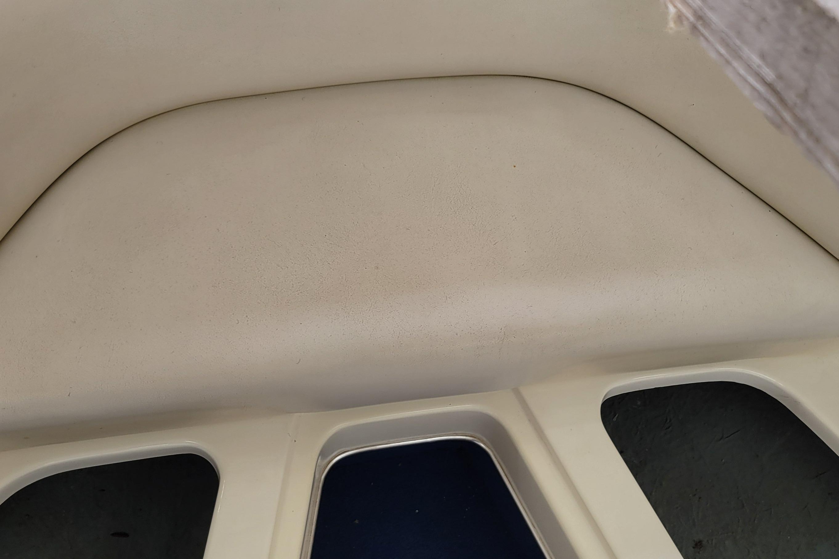 Interior view of a 1994 Sea Ray 180 Bow Rider boat, featuring seating area.