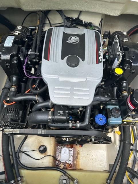 Engine of 2011 Chaparral 216 SSi boat, showcasing detailed components and layout.