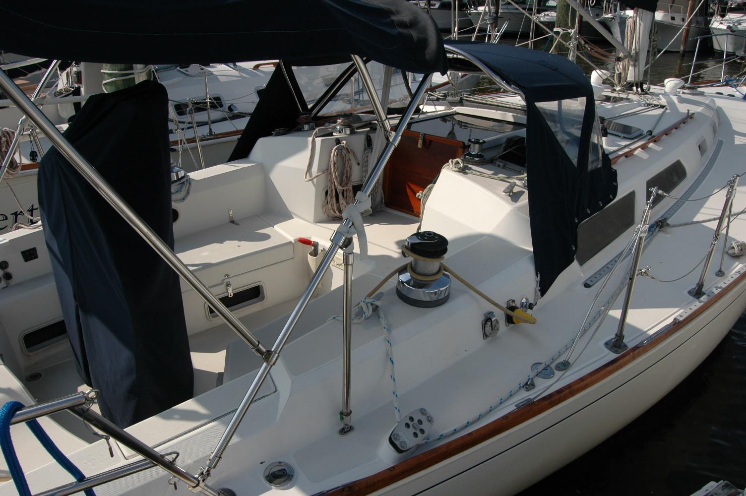 1988 Sabre 38 MkII sailboat cockpit with covered seating and winch.