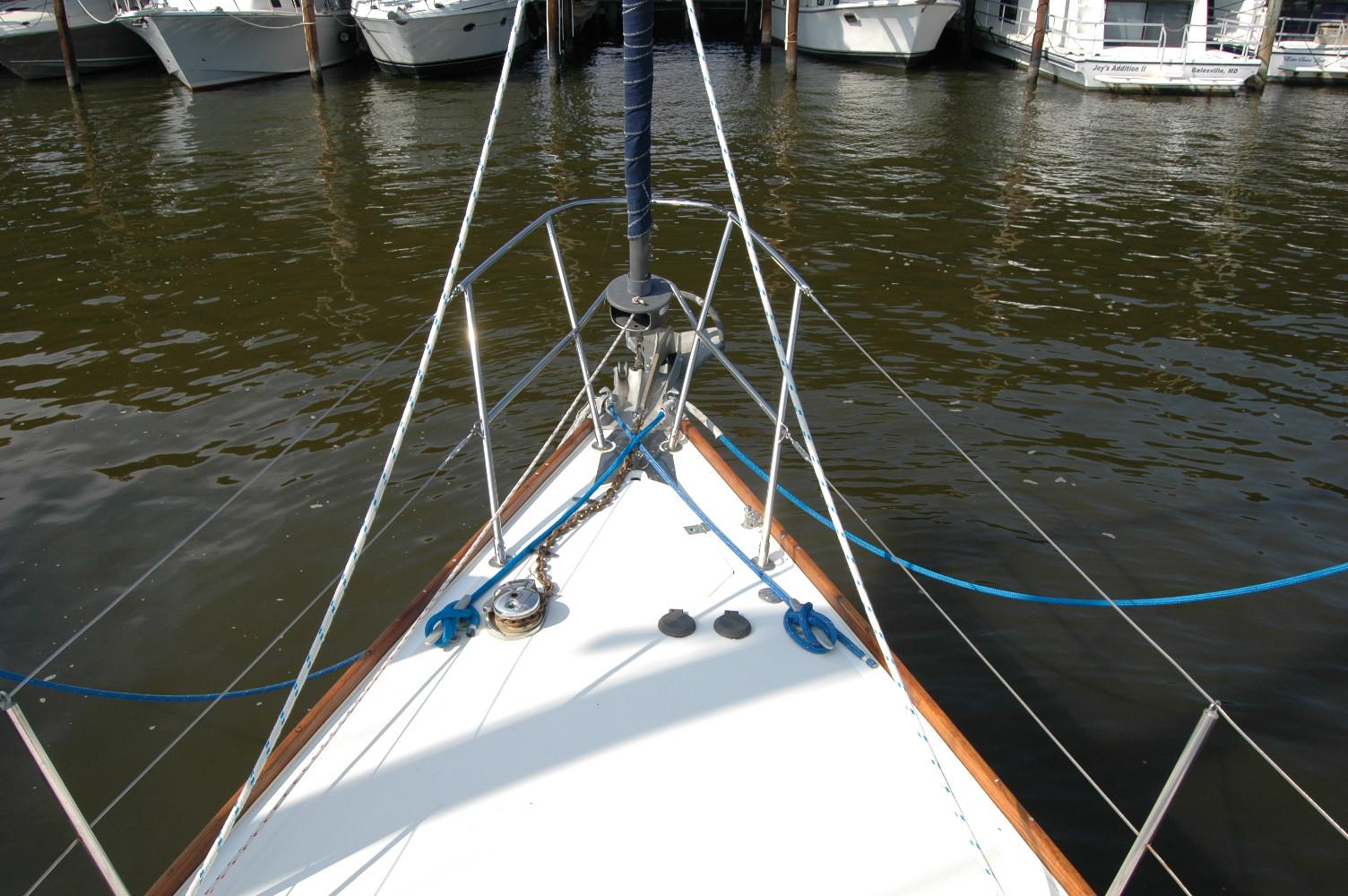 Bow of 1988 Sabre 38 MkII sailboat docked in marina.