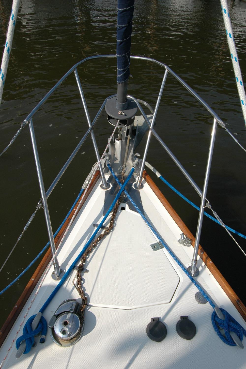 Bow of 1988 Sabre 38 MkII sailboat with anchor chain and ropes.