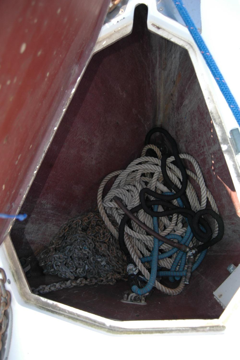 Anchor locker of 1988 Sabre 38 MkII sailboat with ropes and chain.