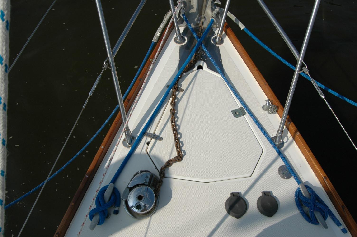 Bow of 1988 Sabre 38 MkII sailboat with anchor chain and ropes.
