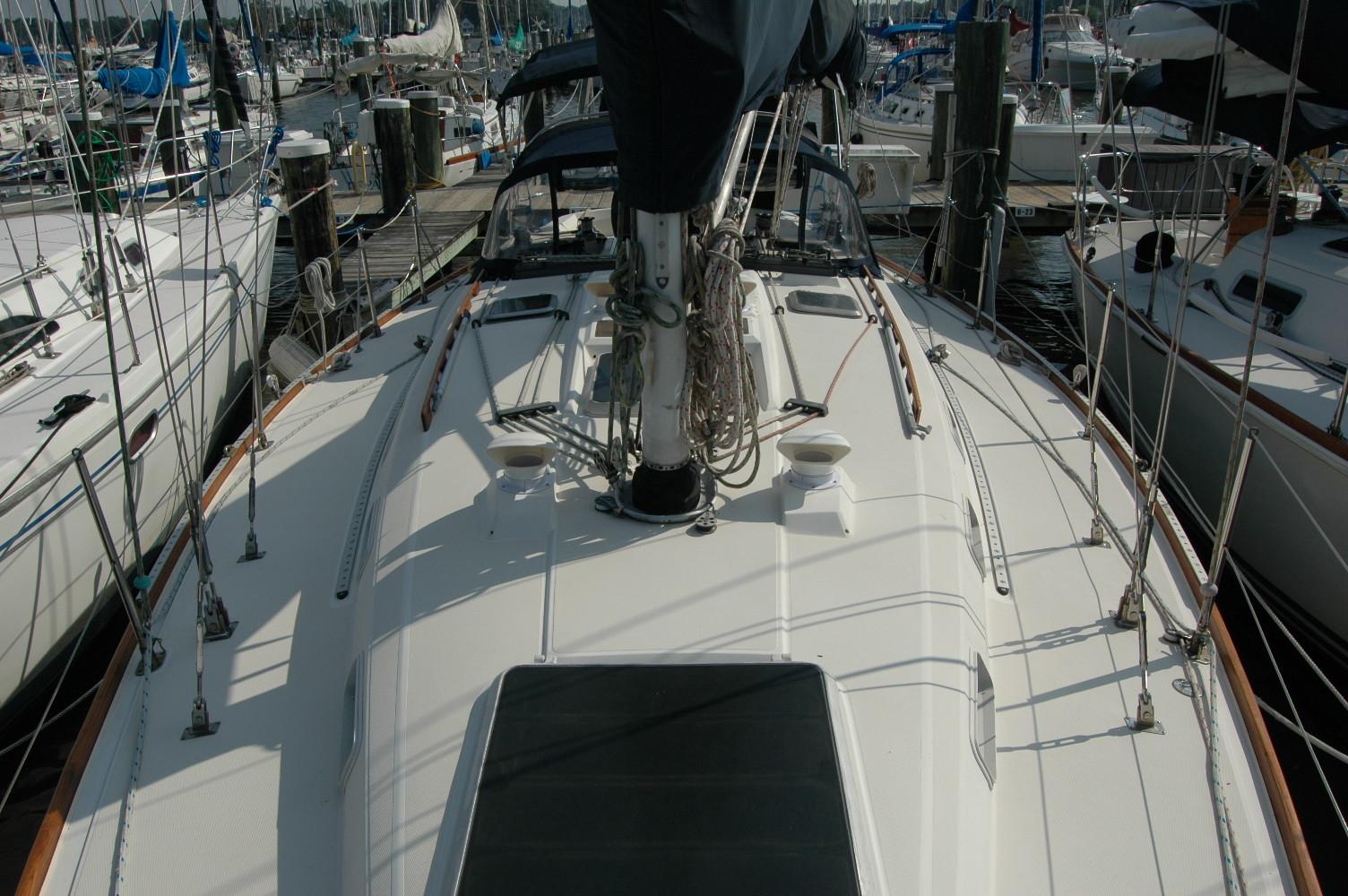1988 Sabre 38 MkII sailboat docked at marina, view of deck and rigging.