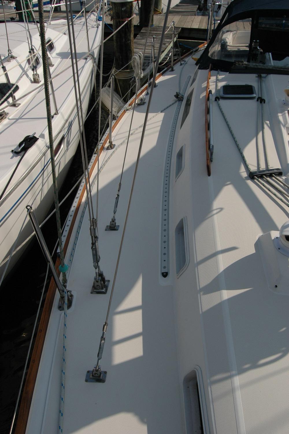1988 Sabre 38 MkII sailboat deck with rigging and dockside view.