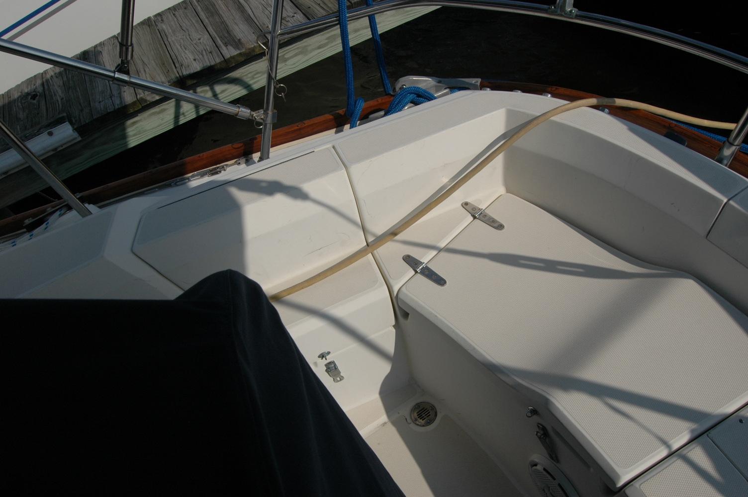 Cockpit of 1988 Sabre 38 MkII sailboat with white seating and railing.