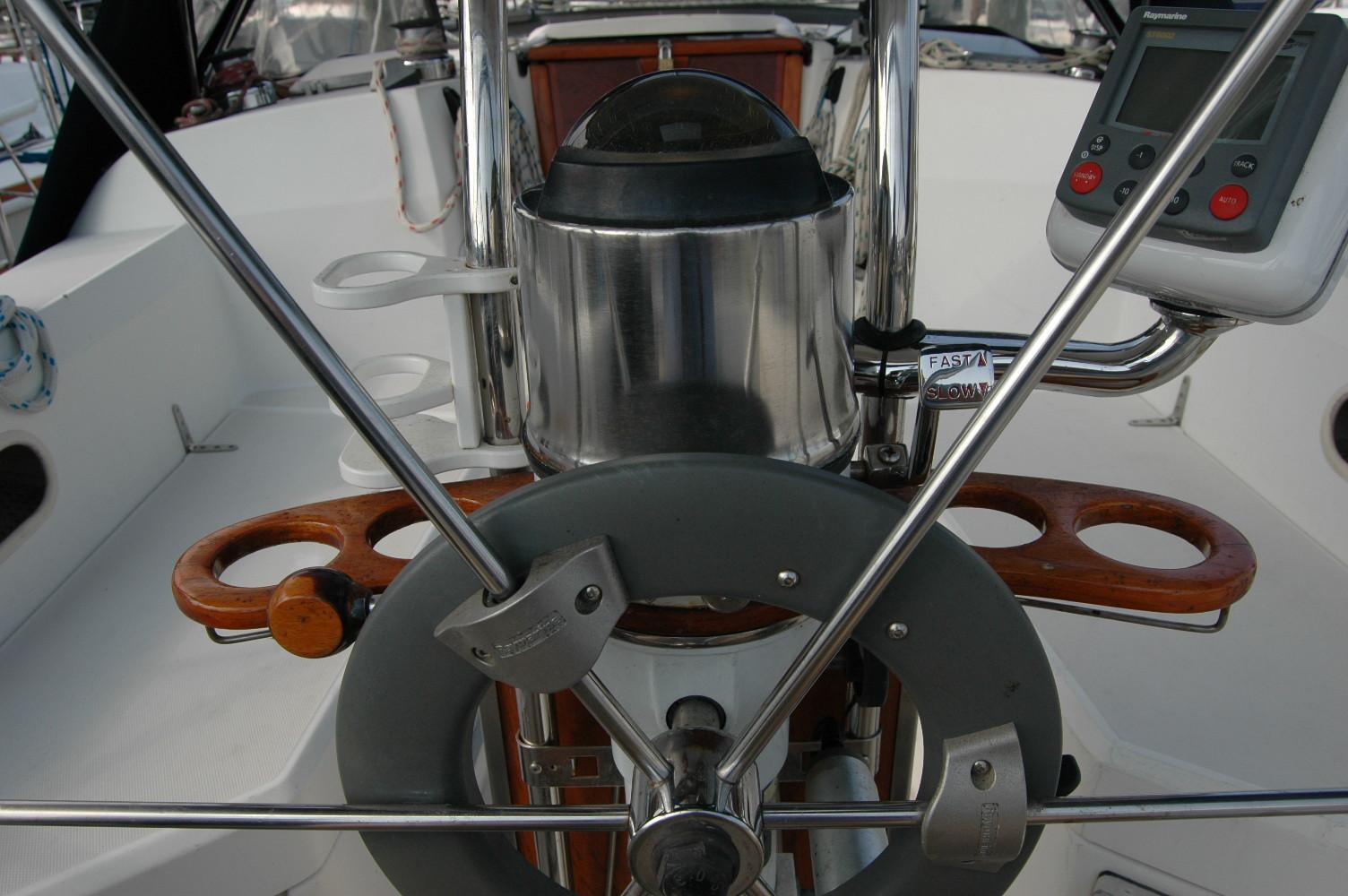 Cockpit of 1988 Sabre 38 MkII sailboat with steering wheel and navigation instruments.