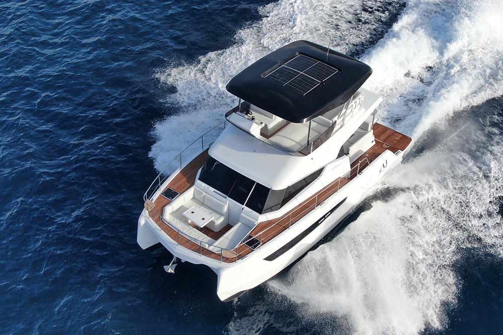 2026 Aventura 38 Motor Yacht cruising on open water, showcasing sleek design and solar panels.
