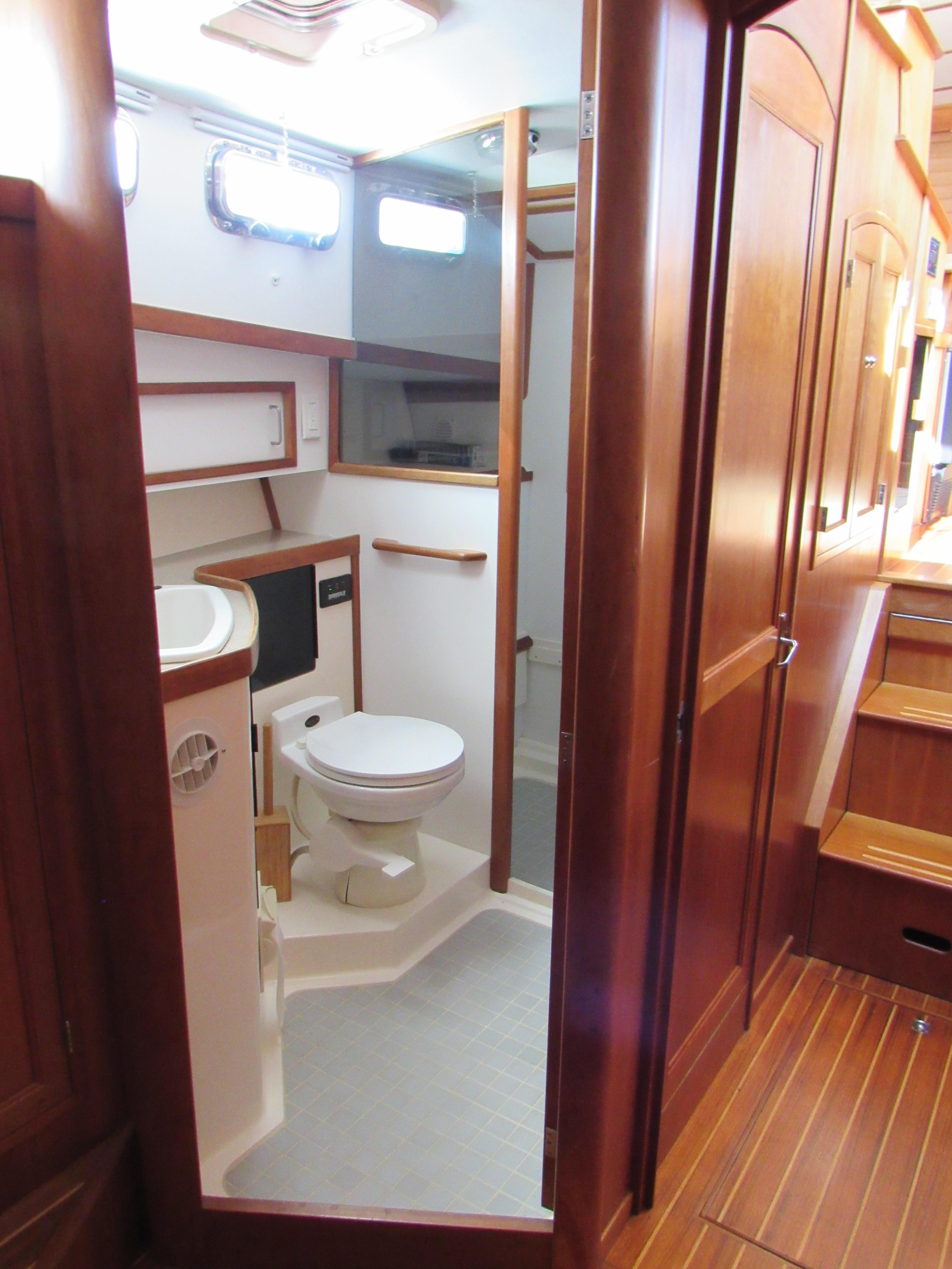 Sabre-Sabreline 47 1999-CANDY O RI-US-1999 Sabreline 47 yacht bathroom with wooden cabinetry and modern fixtures.-9522318 | Thumbnail
