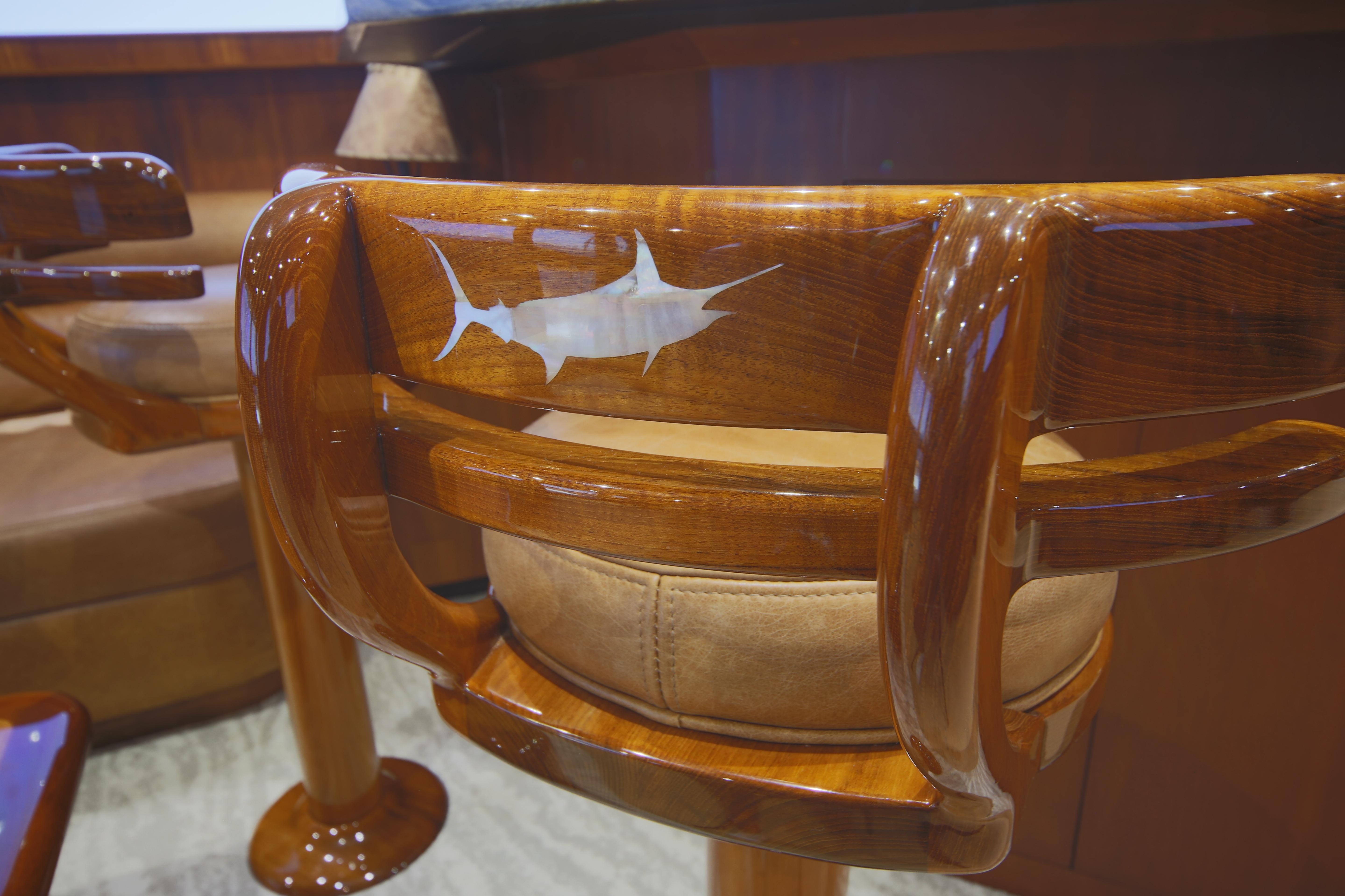 Jim Smith-65 Convertible 2000-PIER PRESSURE SC-US-Luxurious wooden chair with marlin inlay on a Jim Smith 65 Convertible yacht, 2000 model.-9833594 | Thumbnail