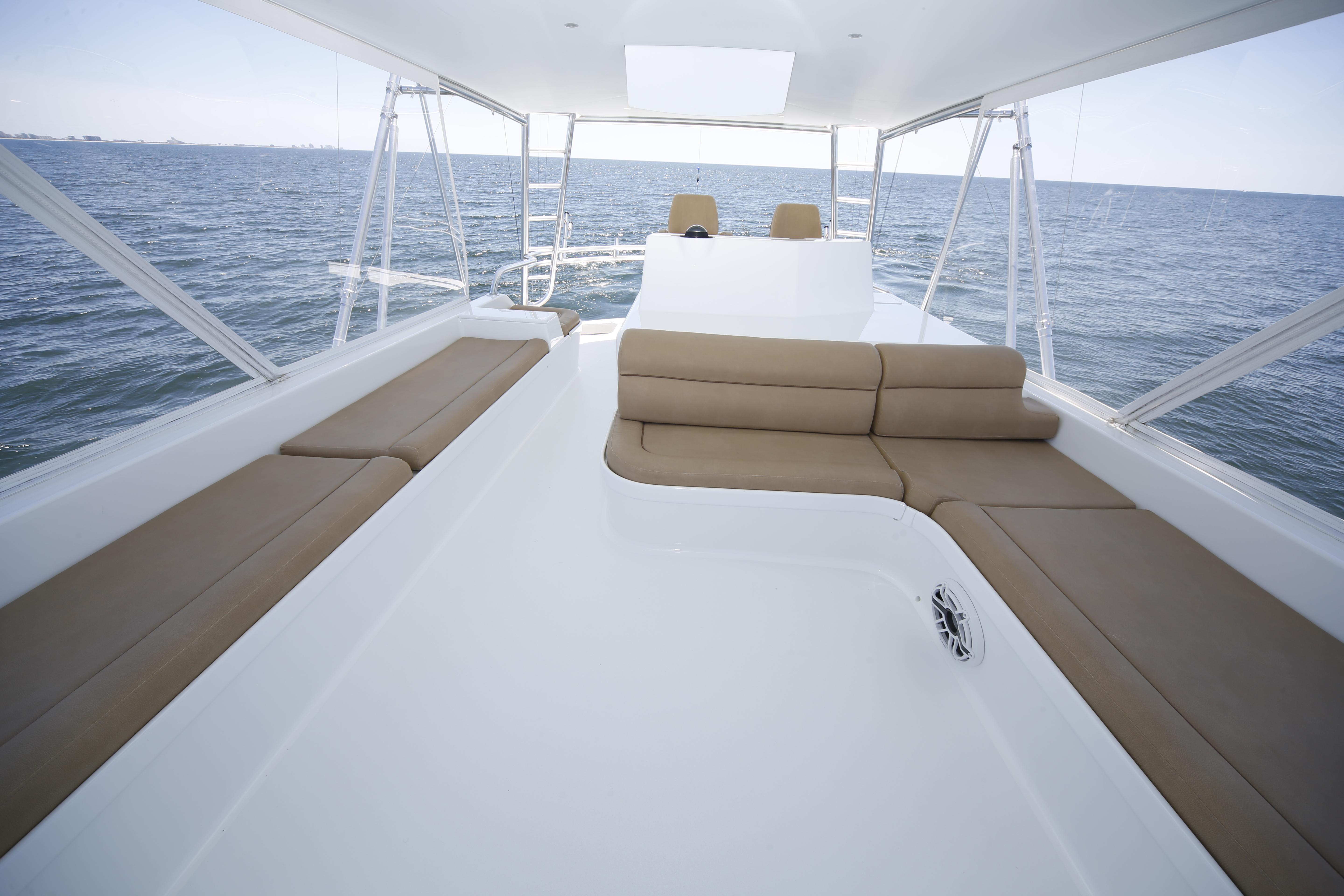 Jim Smith-65 Convertible 2000-PIER PRESSURE SC-US-Luxurious Jim Smith 65 Convertible yacht deck with ocean view, featuring comfortable seating, 2000 model.-9833594 | Thumbnail