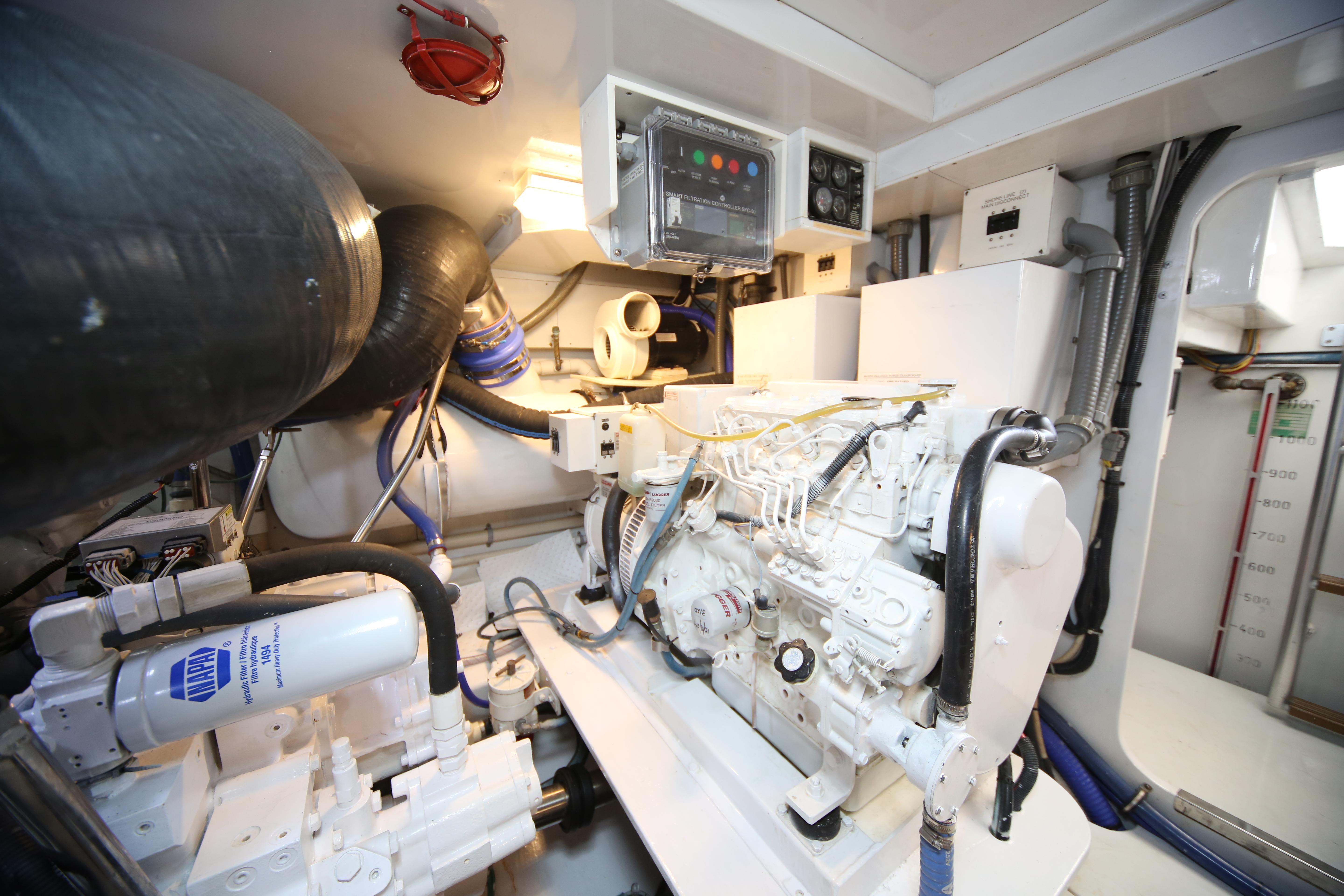 Jim Smith-65 Convertible 2000-PIER PRESSURE SC-US-Engine room of a 2000 Jim Smith 65 Convertible yacht, showcasing machinery and control panels.-9833594 | Thumbnail