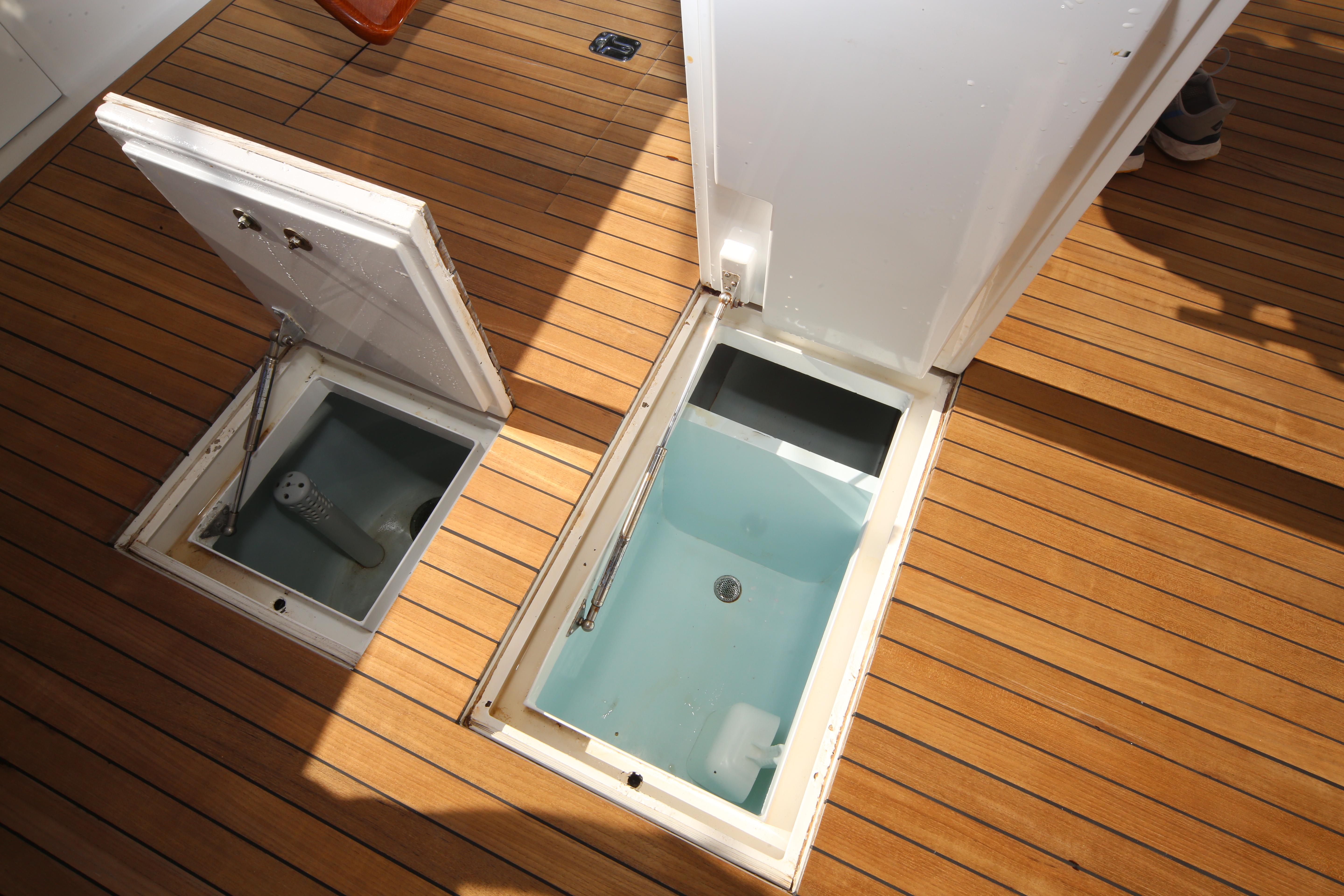 Jim Smith-65 Convertible 2000-PIER PRESSURE SC-US-Open storage compartments on a Jim Smith 65 Convertible boat deck, 2000 model.-9833594 | Thumbnail