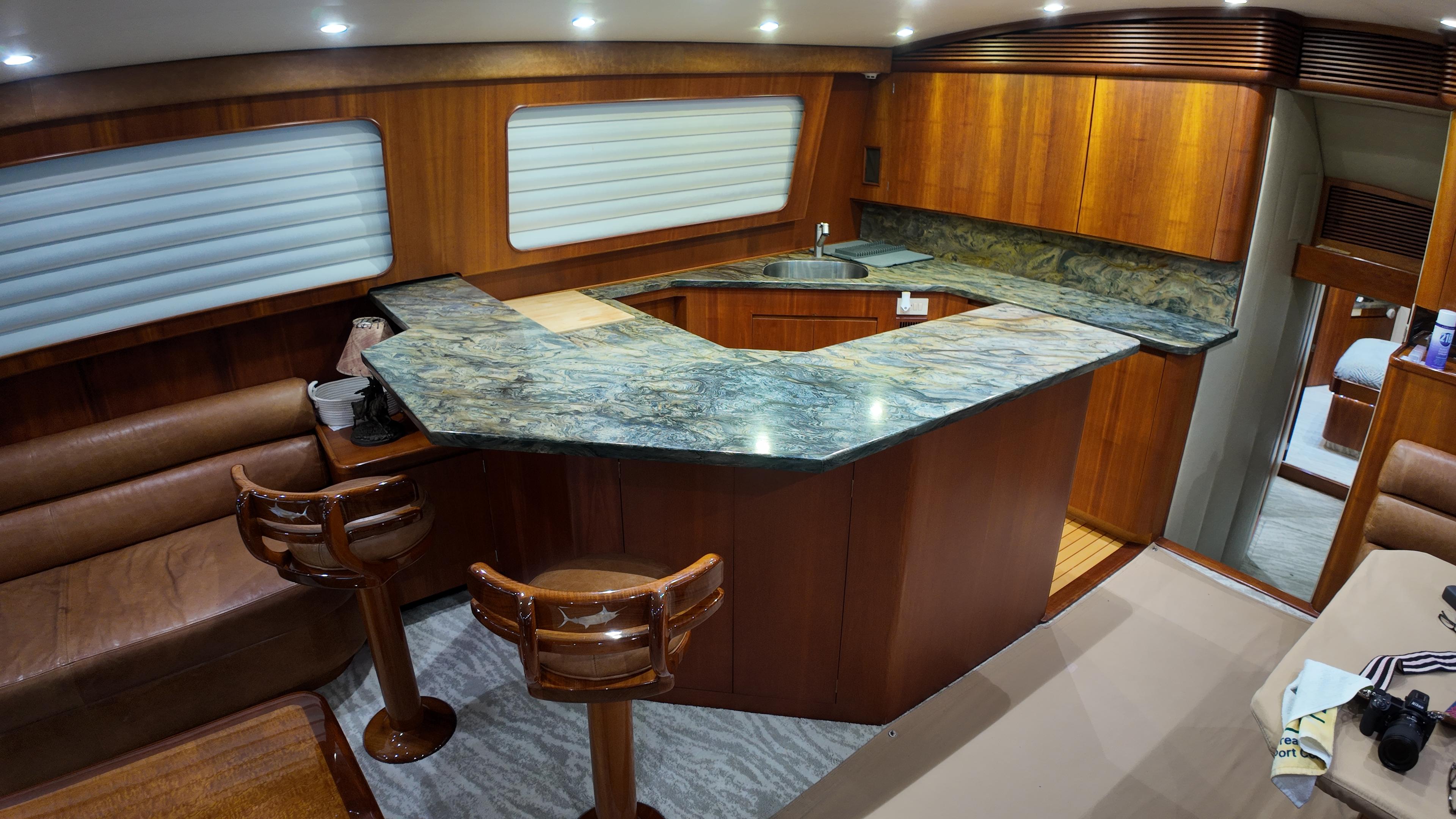 Jim Smith-65 Convertible 2000-PIER PRESSURE SC-US-Luxurious yacht interior with wooden cabinetry and marble countertops, Jim Smith 65 Convertible, 2000 model.-9833594 | Thumbnail