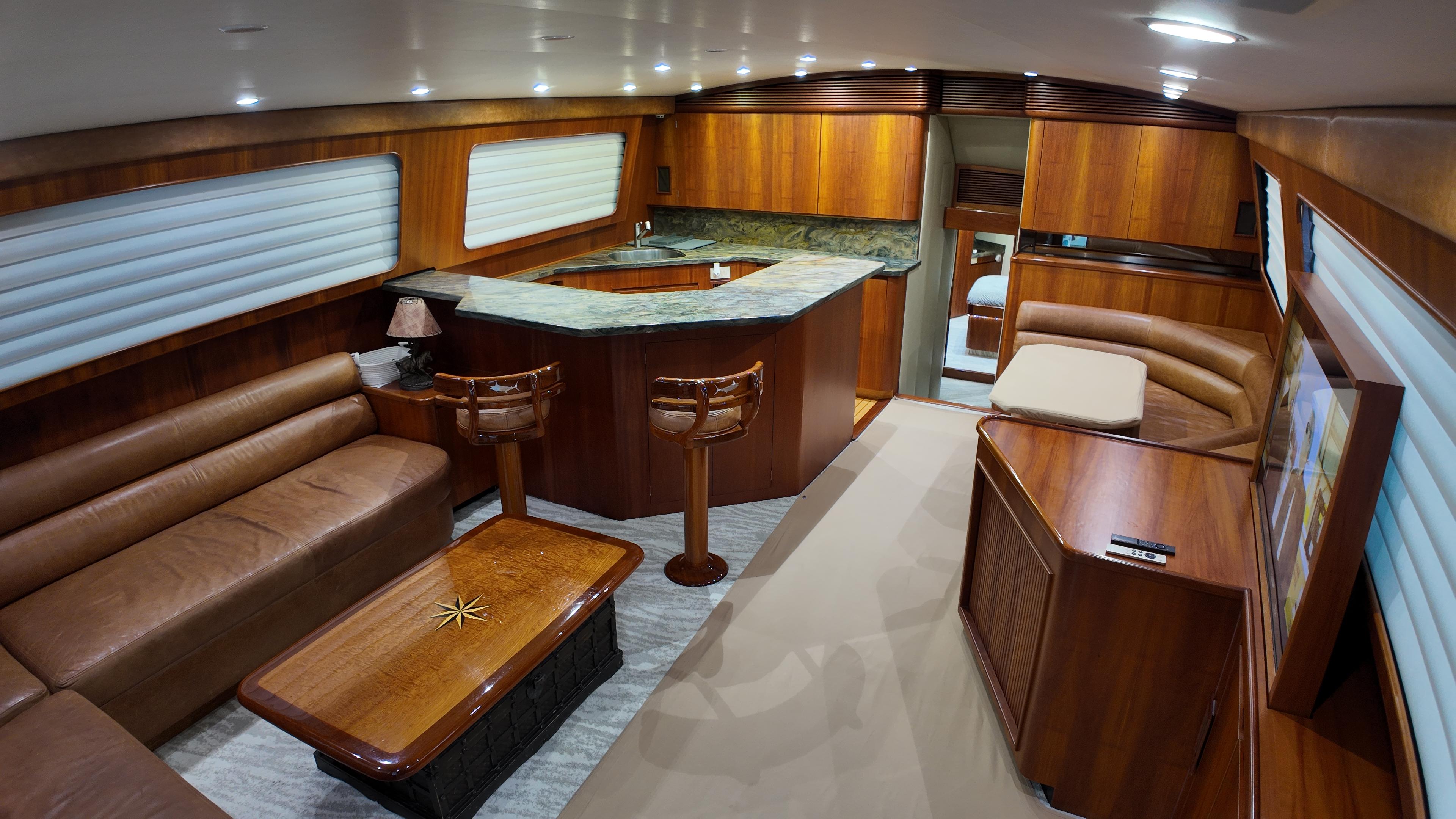 Jim Smith-65 Convertible 2000-PIER PRESSURE SC-US-Luxurious interior of a 2000 Jim Smith 65 Convertible yacht with wood finishes and leather seating.-9833594 | Thumbnail