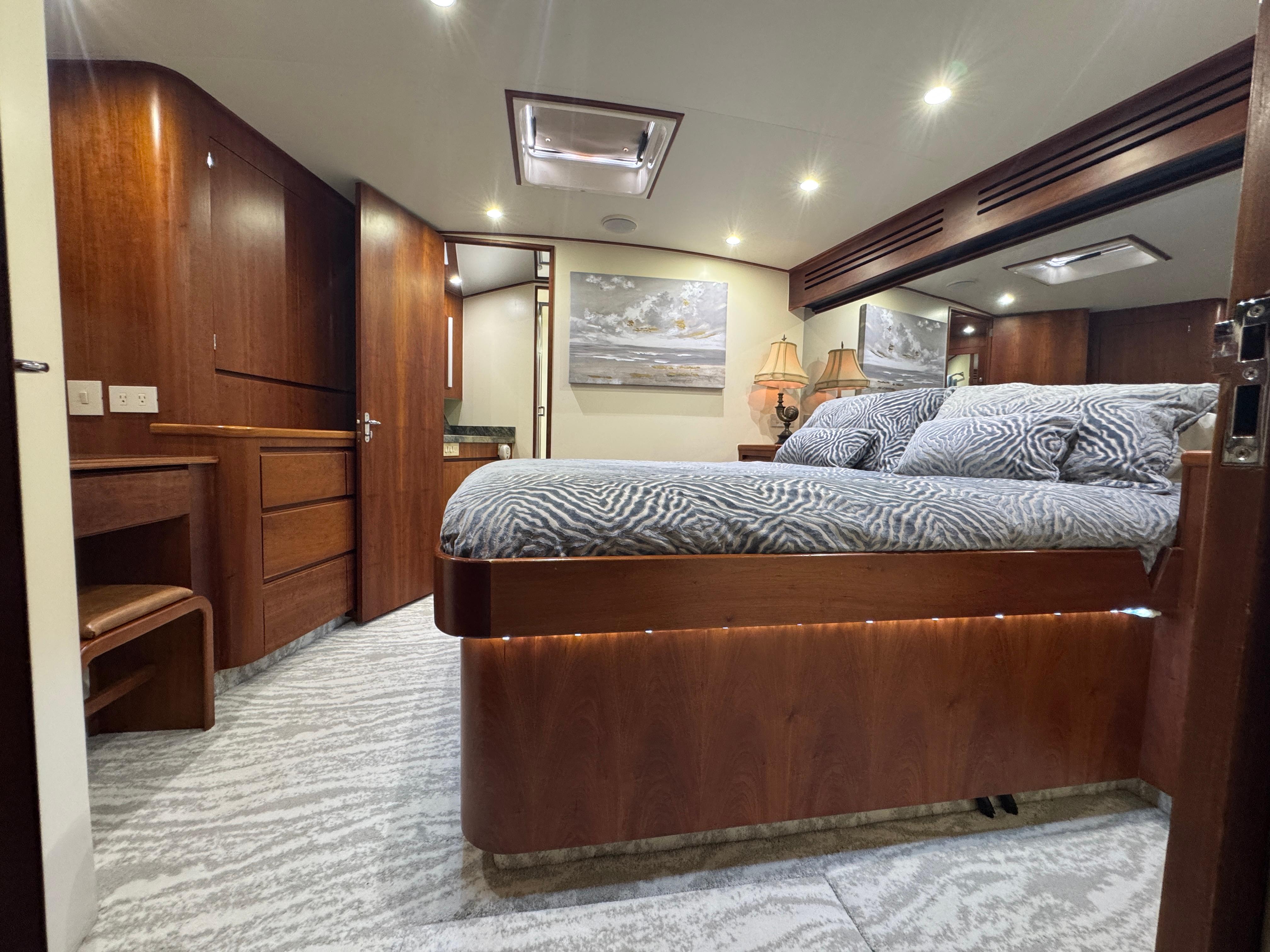 Jim Smith-65 Convertible 2000-PIER PRESSURE SC-US-Luxurious bedroom interior of a 2000 Jim Smith 65 Convertible yacht with elegant wood finishes.-9833594 | Thumbnail