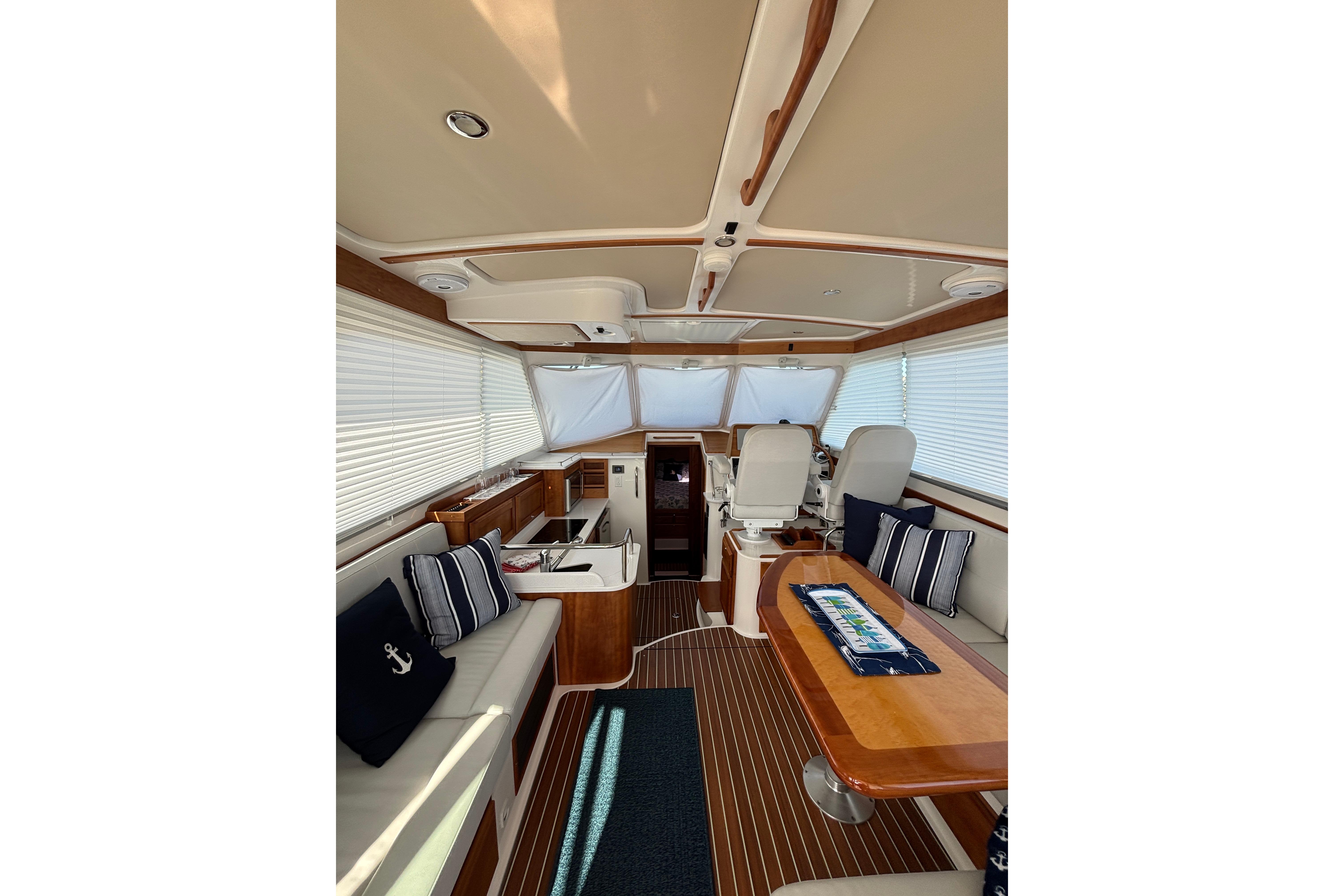 Luxurious interior of 2020 Back Cove 37 yacht with elegant seating and wooden finishes.