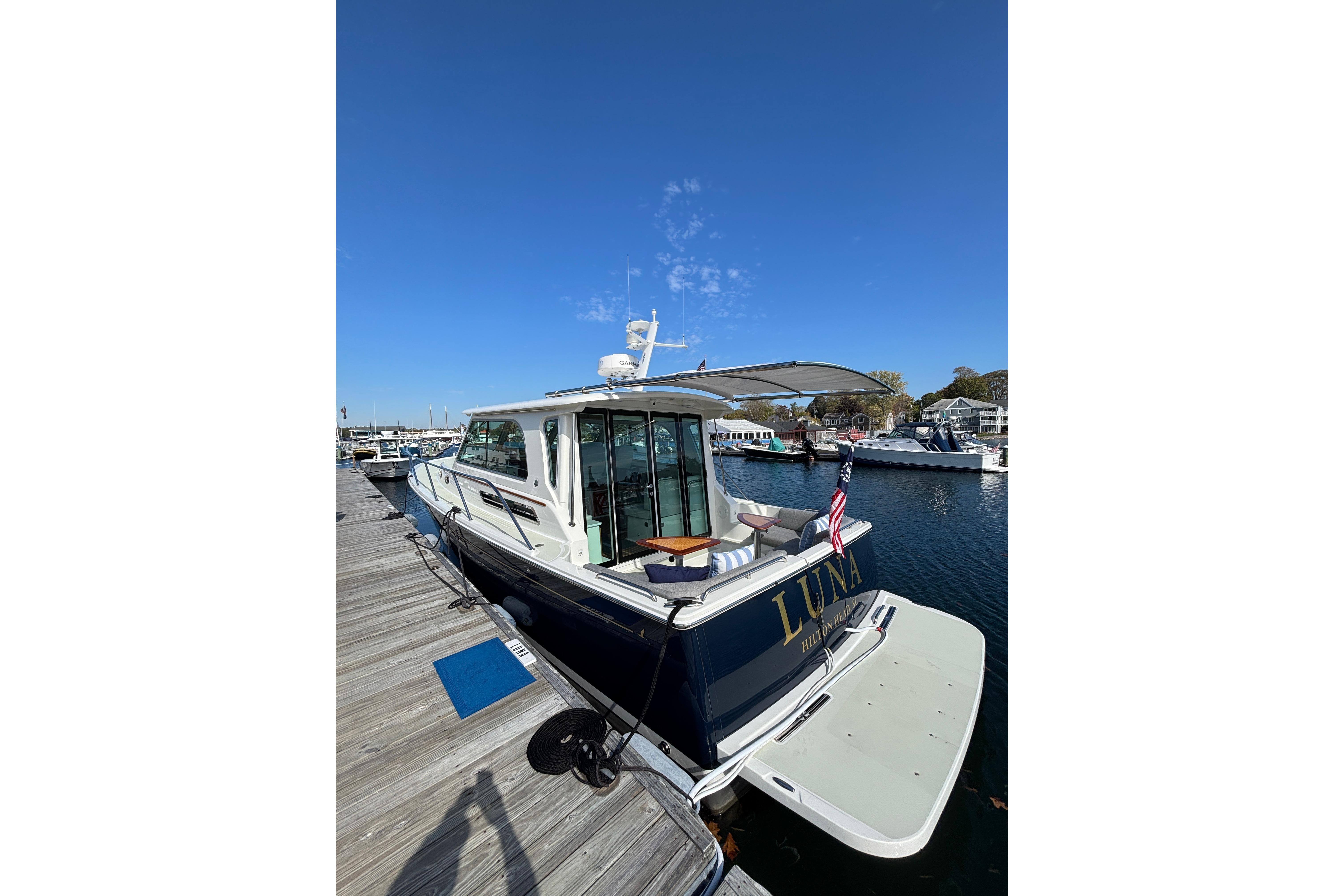 2020 Back Cove 37 yacht docked, featuring sleek design and spacious deck.