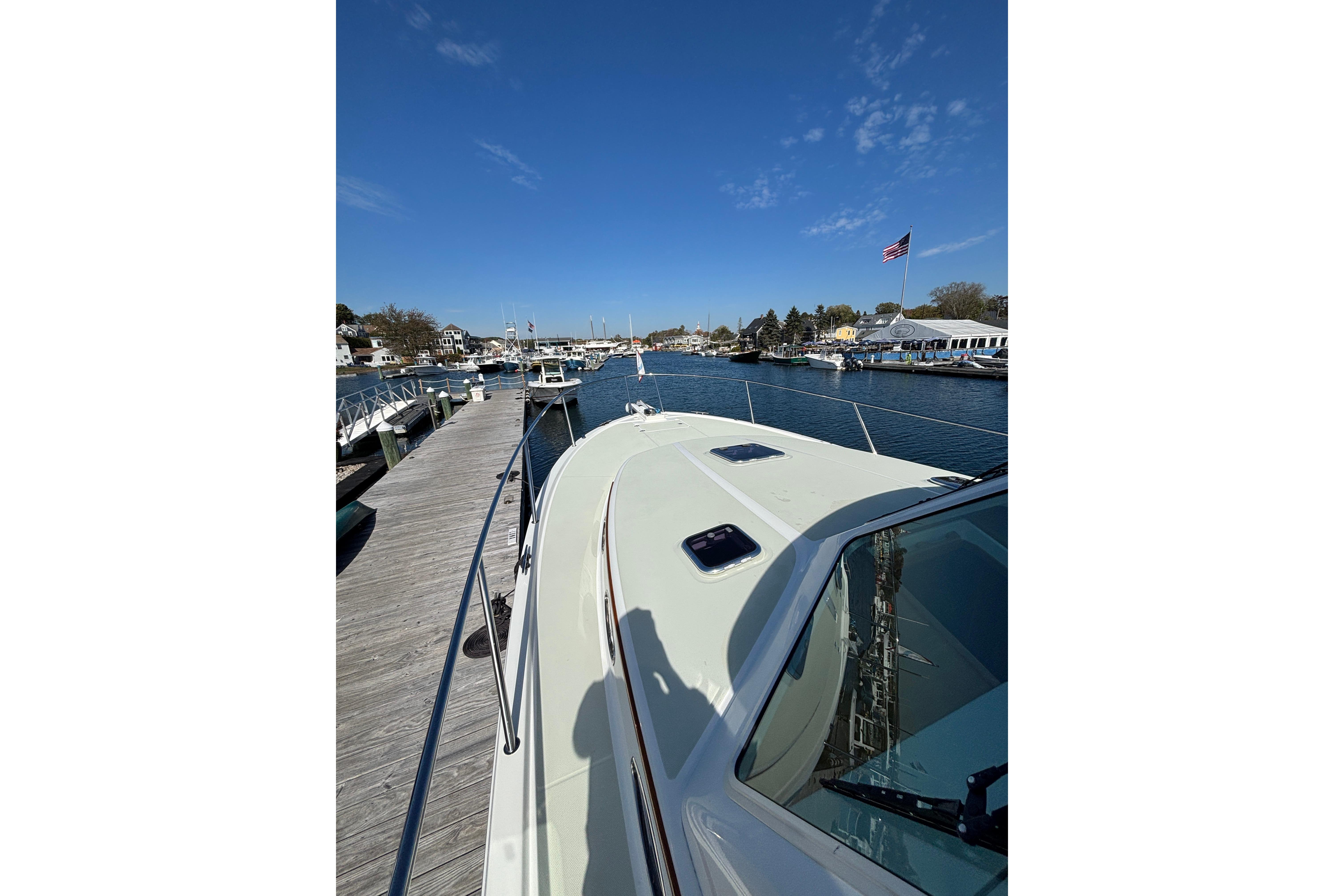2020 Back Cove 37 yacht docked at a marina under a clear blue sky.
