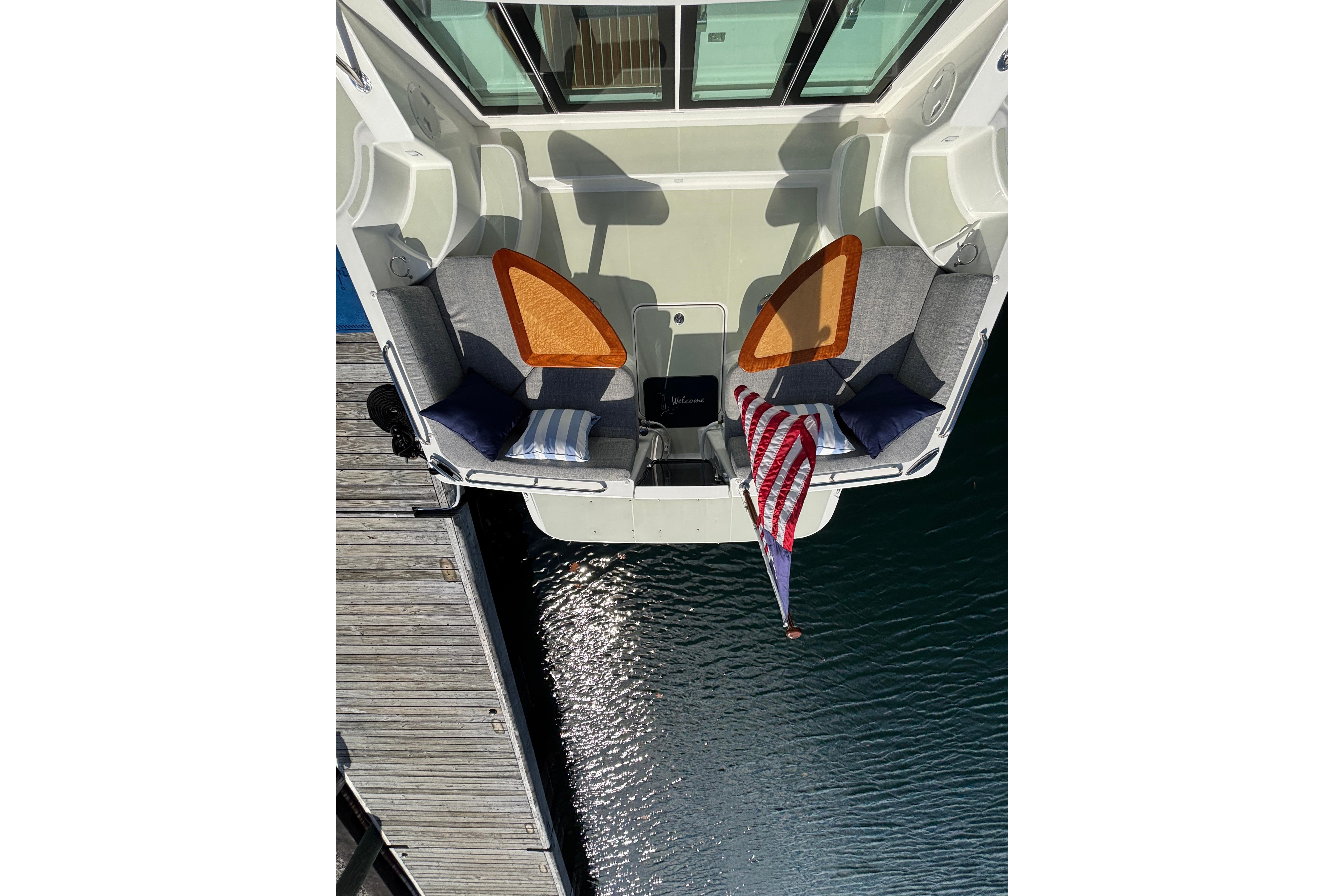 Aerial view of 2020 Back Cove 37 boat with seating and American flag.