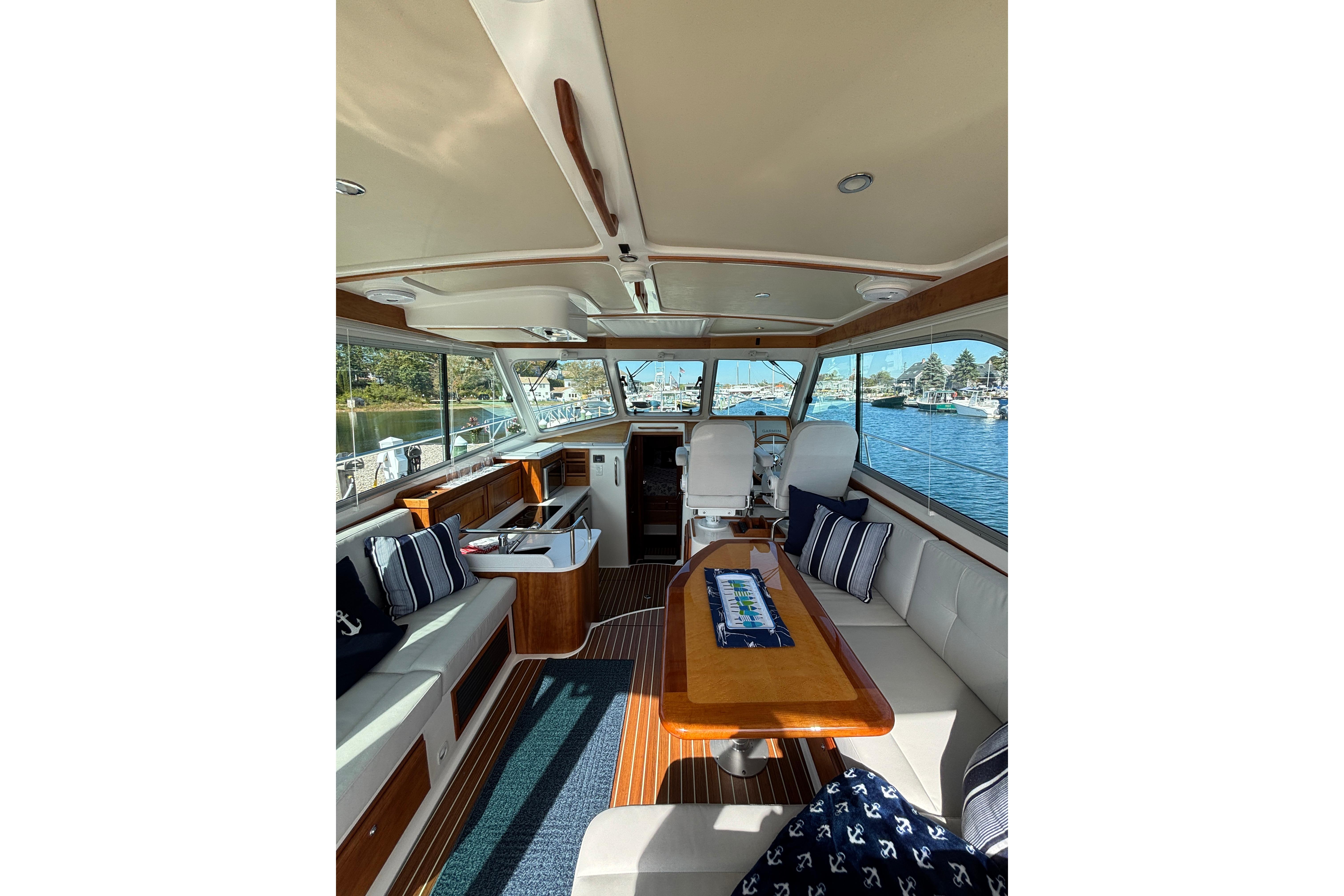 Interior of 2020 Back Cove 37 yacht with elegant seating and scenic water view.