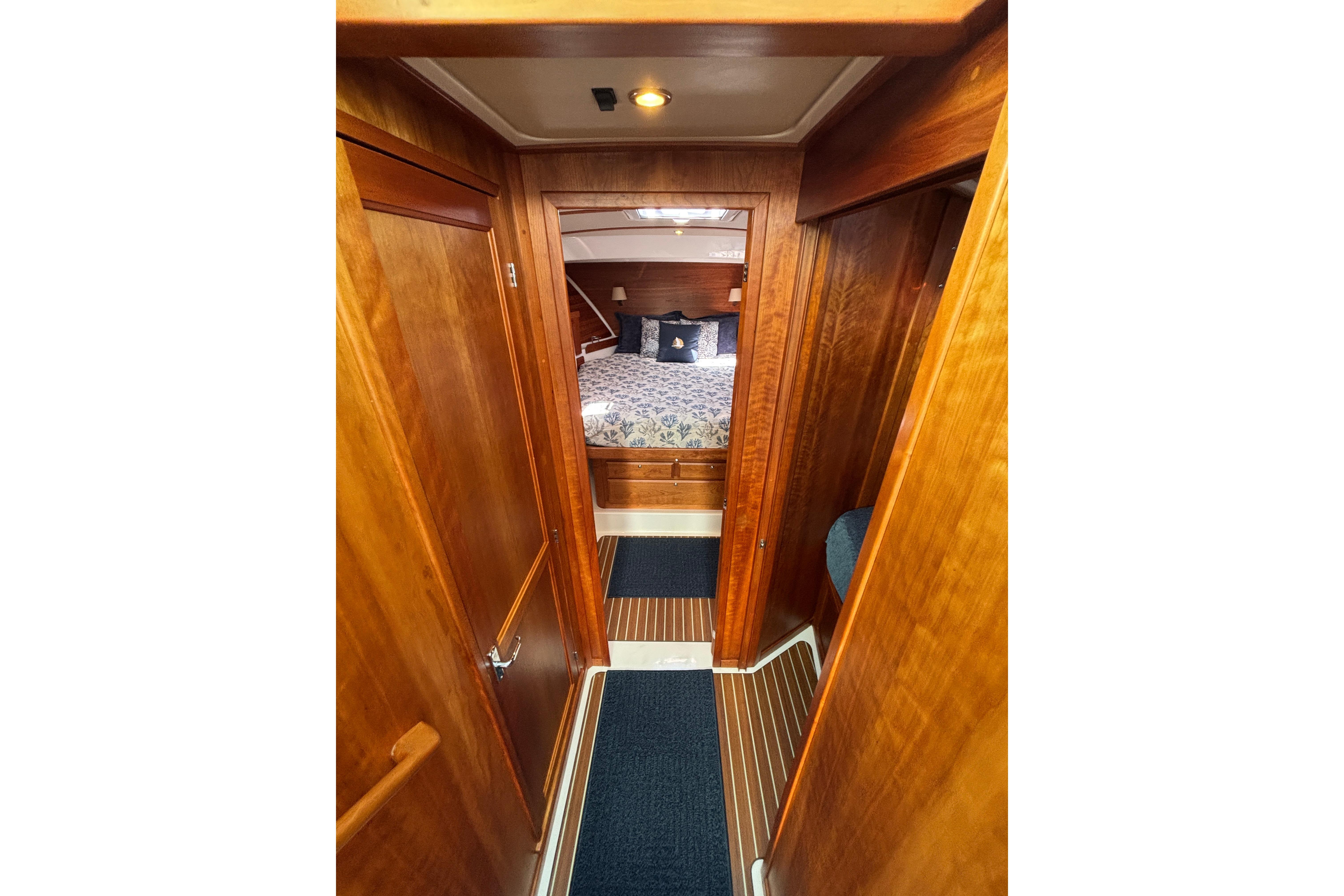 2020 Back Cove 37 yacht interior with wooden finish and cozy bedroom.