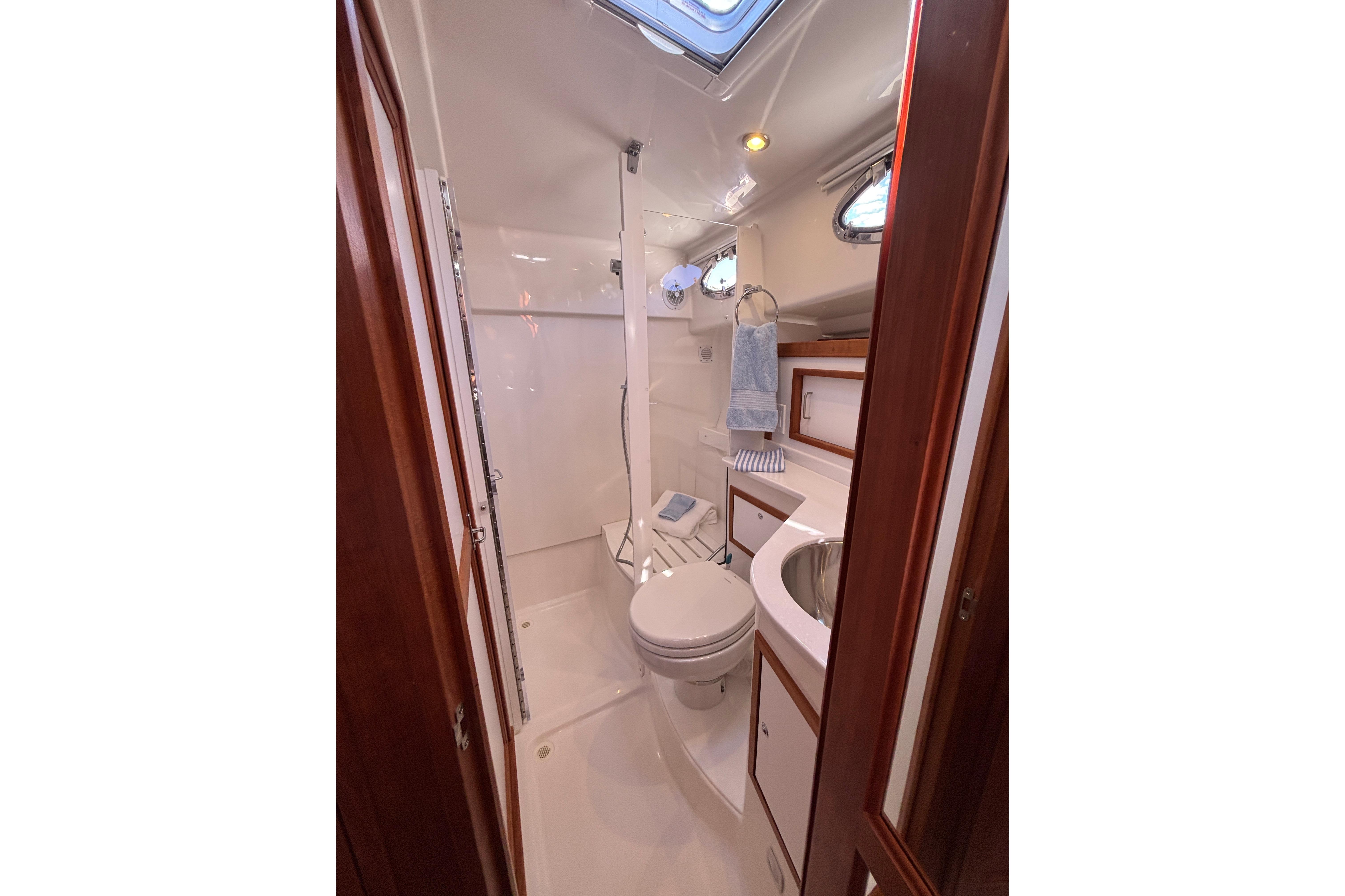 2020 Back Cove 37 yacht bathroom with shower, sink, and toilet.