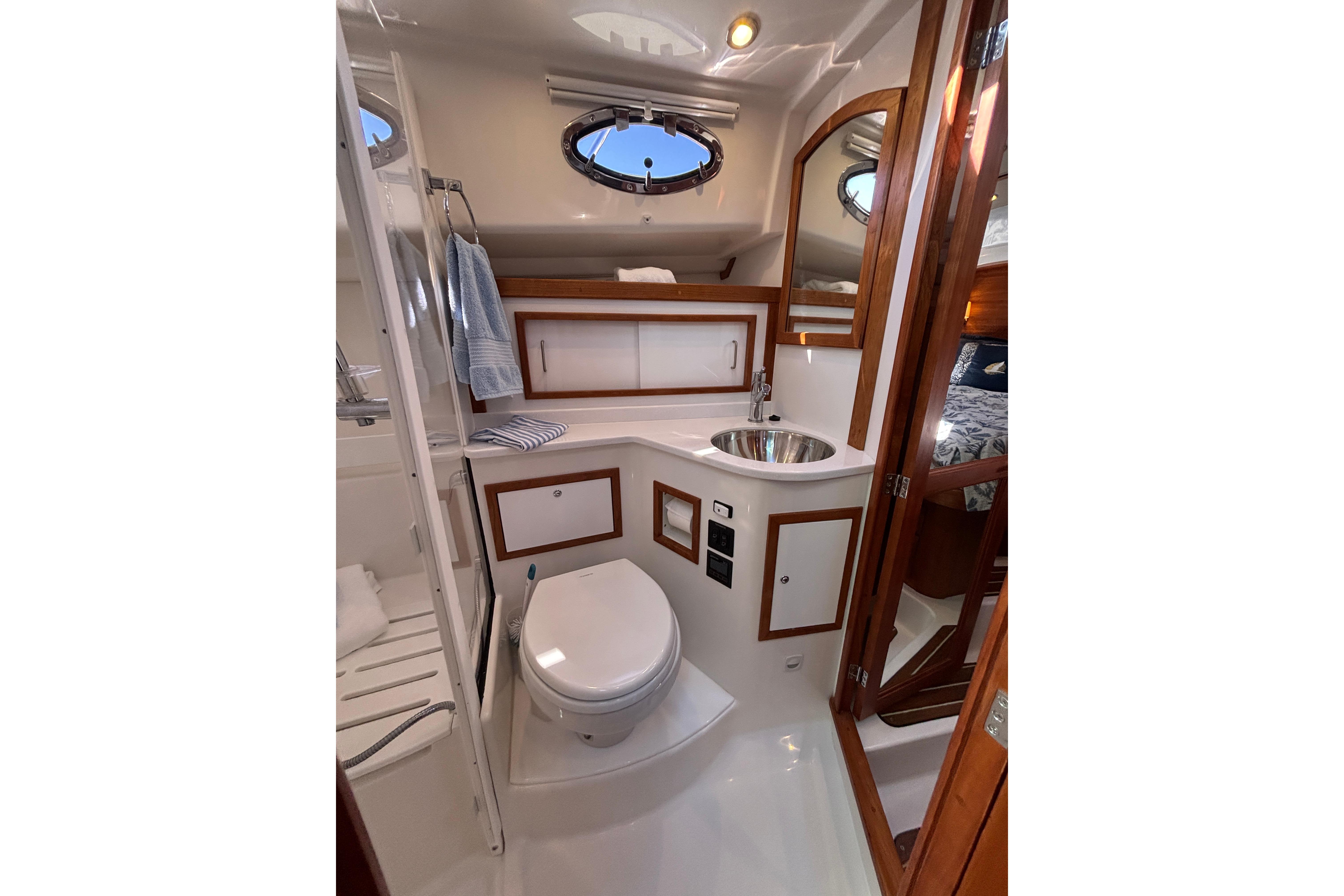 Luxurious 2020 Back Cove 37 yacht bathroom with modern fixtures and elegant wood accents.