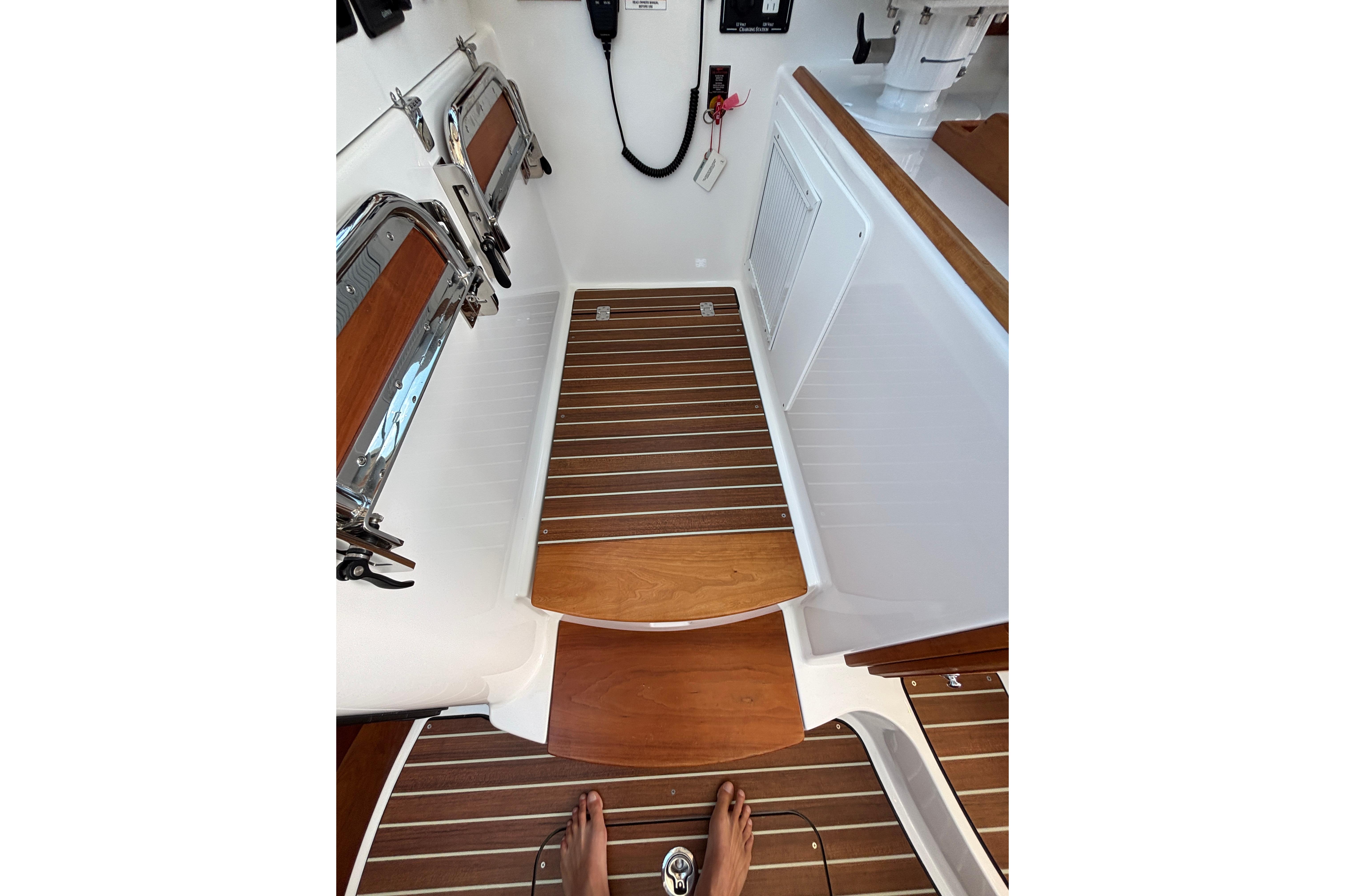 2020 Back Cove 37 boat interior with wooden flooring and stainless steel fixtures.