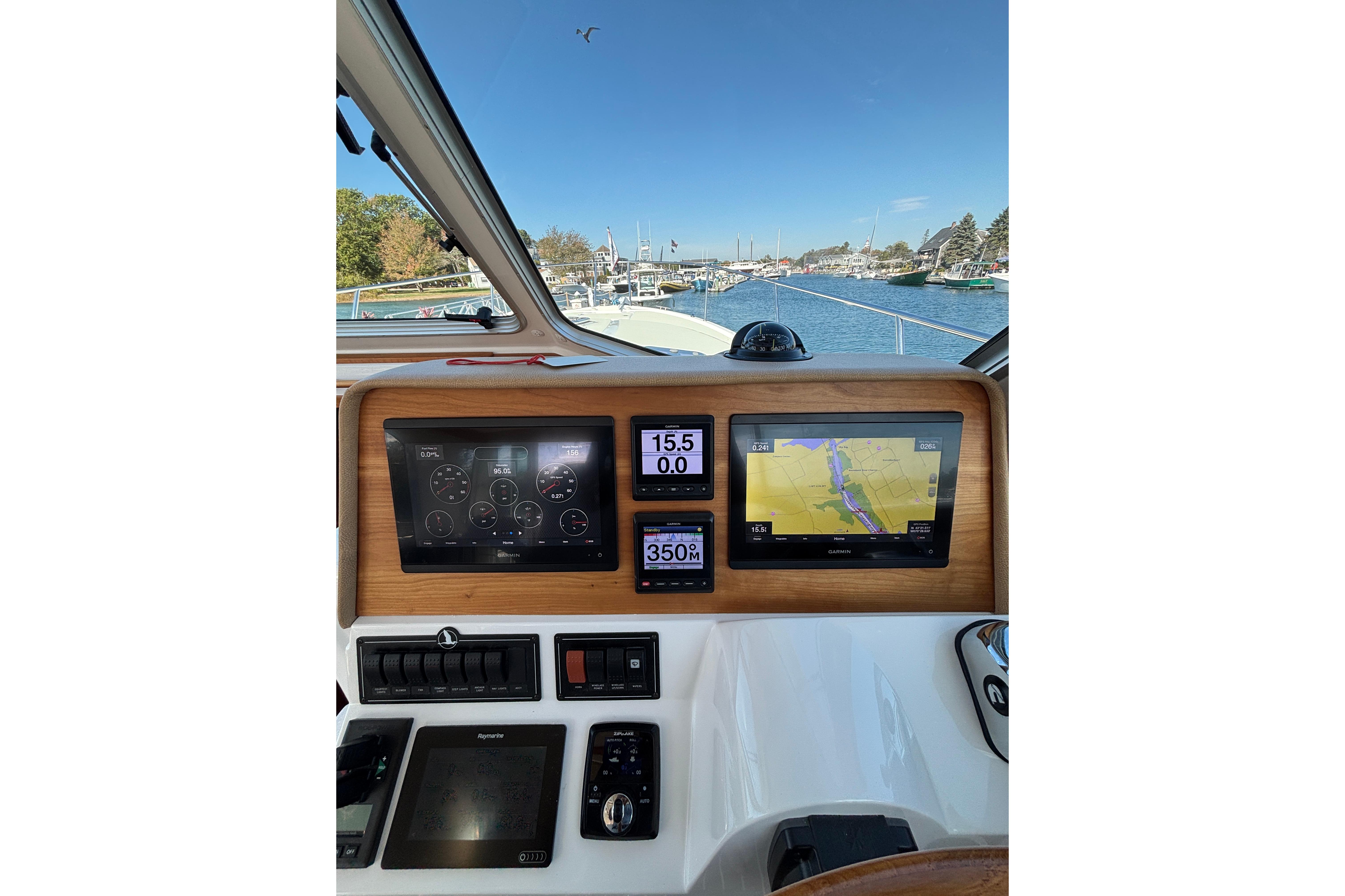 Helm of 2020 Back Cove 37 boat with navigation screens and controls.
