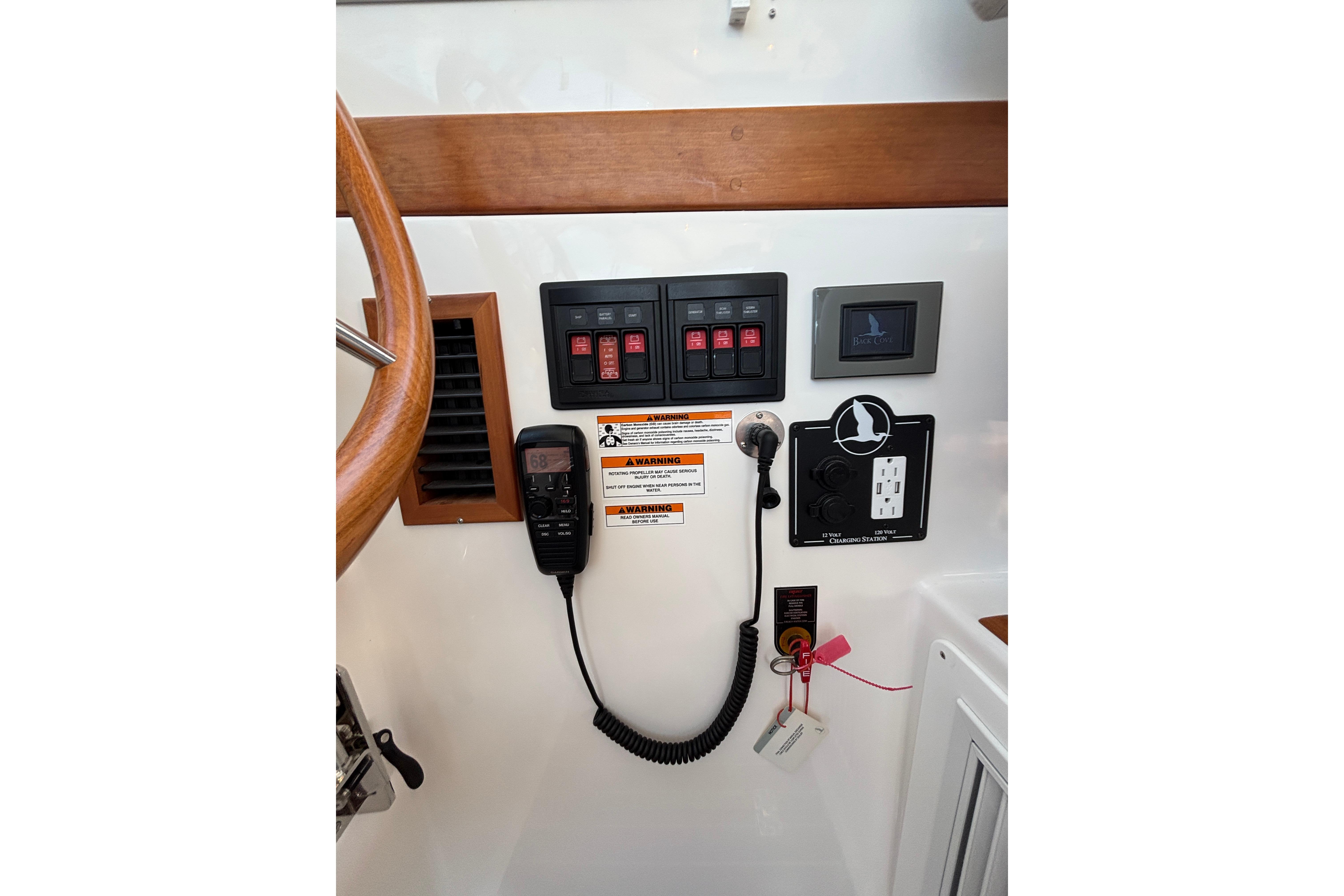 Control panel of 2020 Back Cove 37 boat with switches and communication equipment.