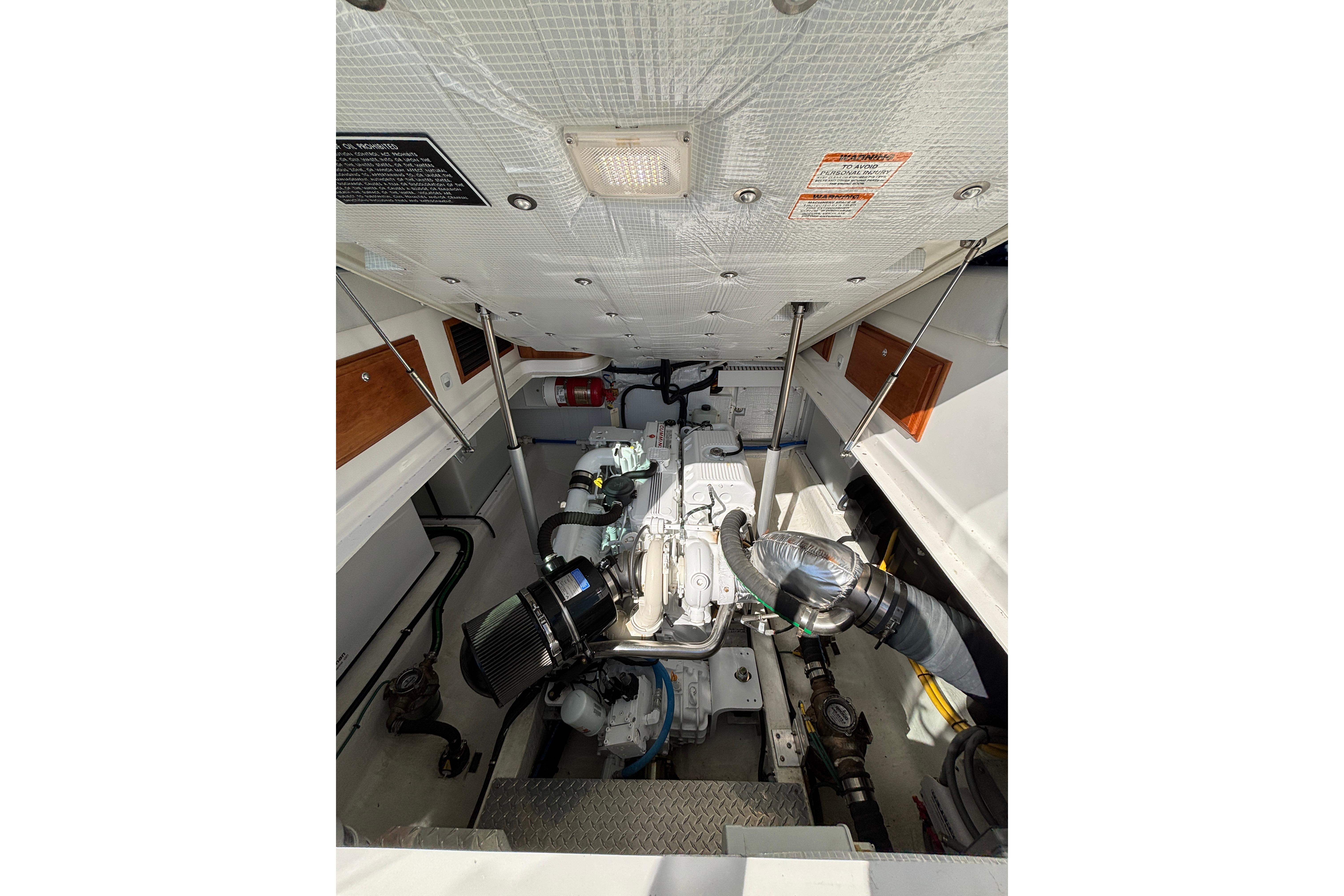 Engine compartment of 2020 Back Cove 37 boat, showcasing mechanical components.