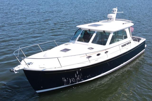 2020 Back Cove 37 boat cruising on open water, showcasing sleek design and modern features.