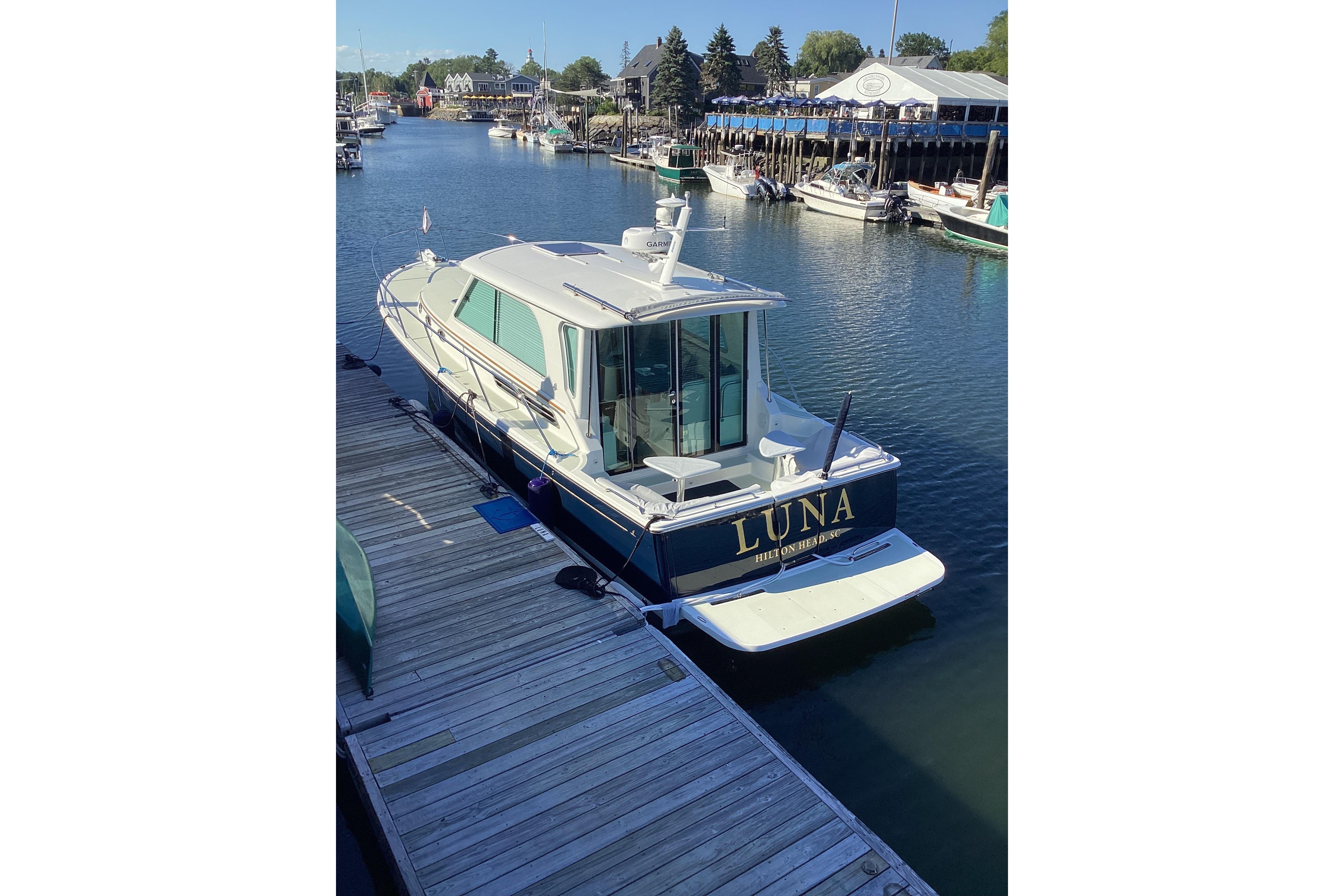 2020 Back Cove 37 boat u0022Lunau0022 docked in a scenic marina.