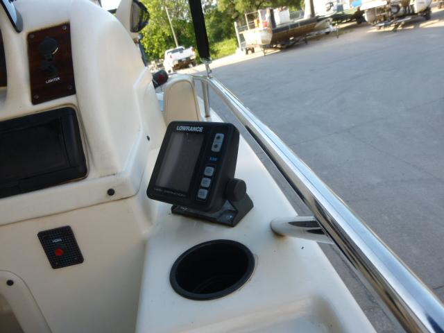 Console of a 2000 SeaArk Sunstar 21 boat with Lowrance device.