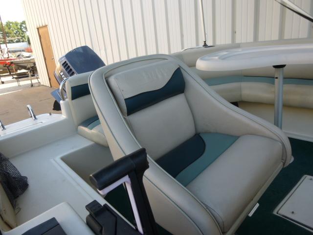 Interior of a 2000 SeaArk Sunstar 21 boat with cushioned seating.