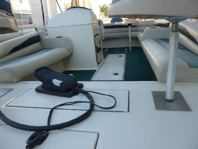 Interior of a 2000 SeaArk Sunstar 21 boat with seating and equipment.