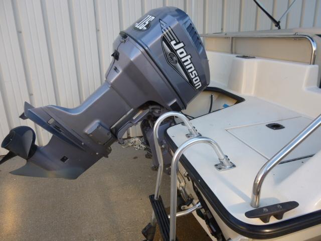 Outboard motor on 2000 SeaArk Sunstar 21 boat, featuring Johnson branding.